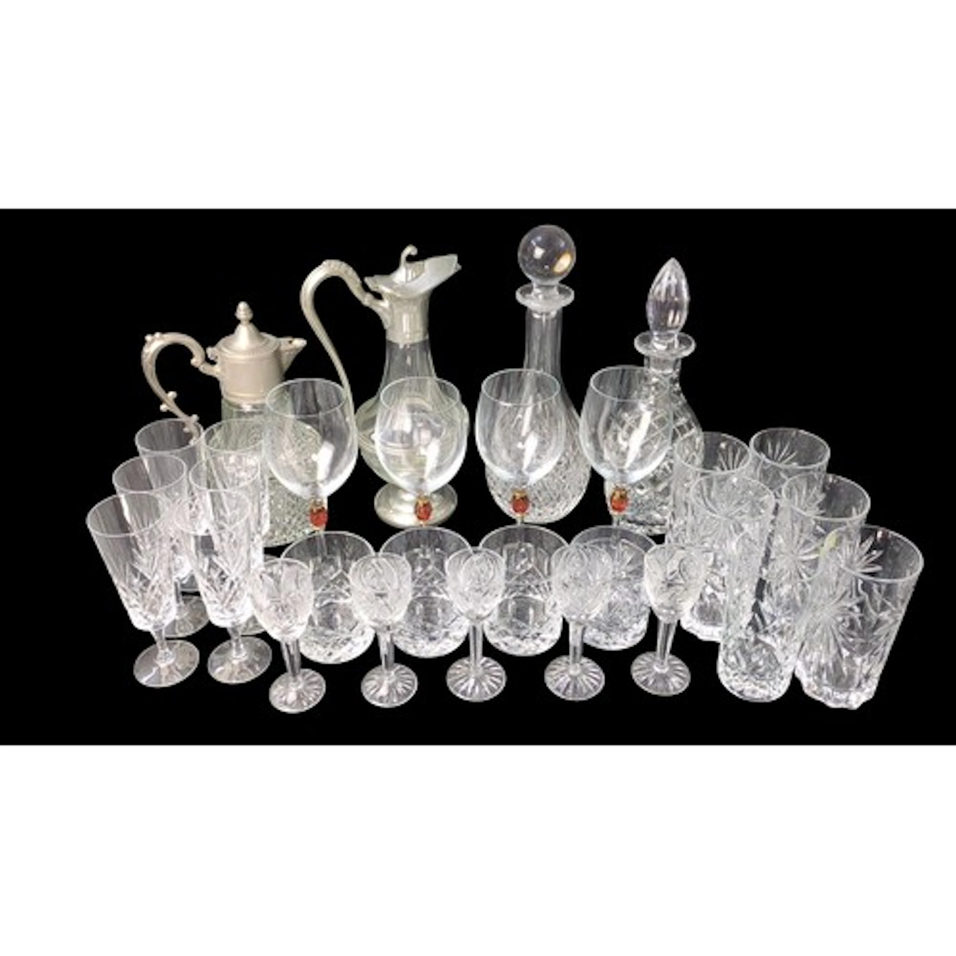 A collection of cut-glass tableware, including white-metal-m...