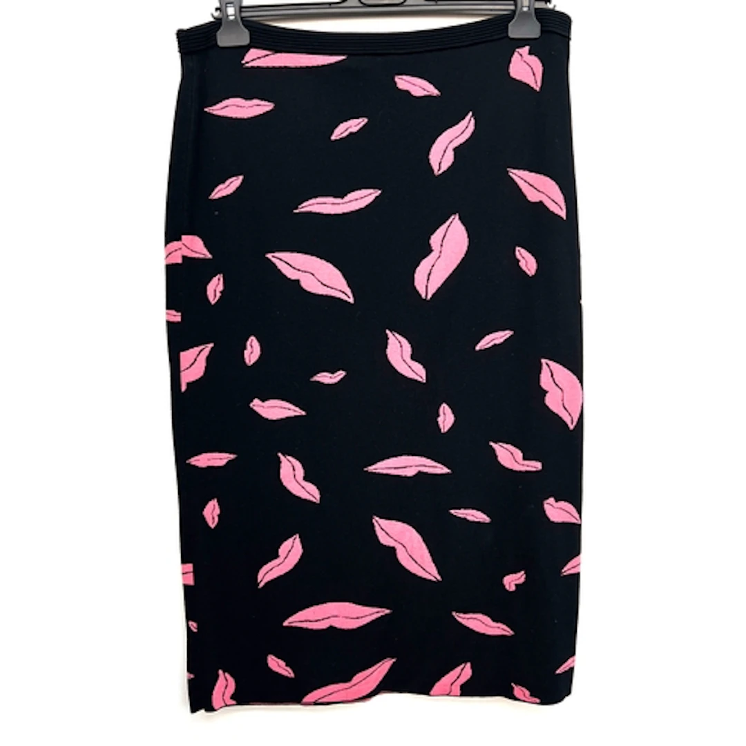A Diane von Furstenberg black wool blend skirt with pink lip...