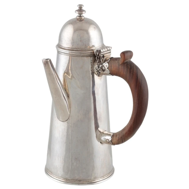 A Queen Anne silver chocolate pot with hinged cover, by Isaa...