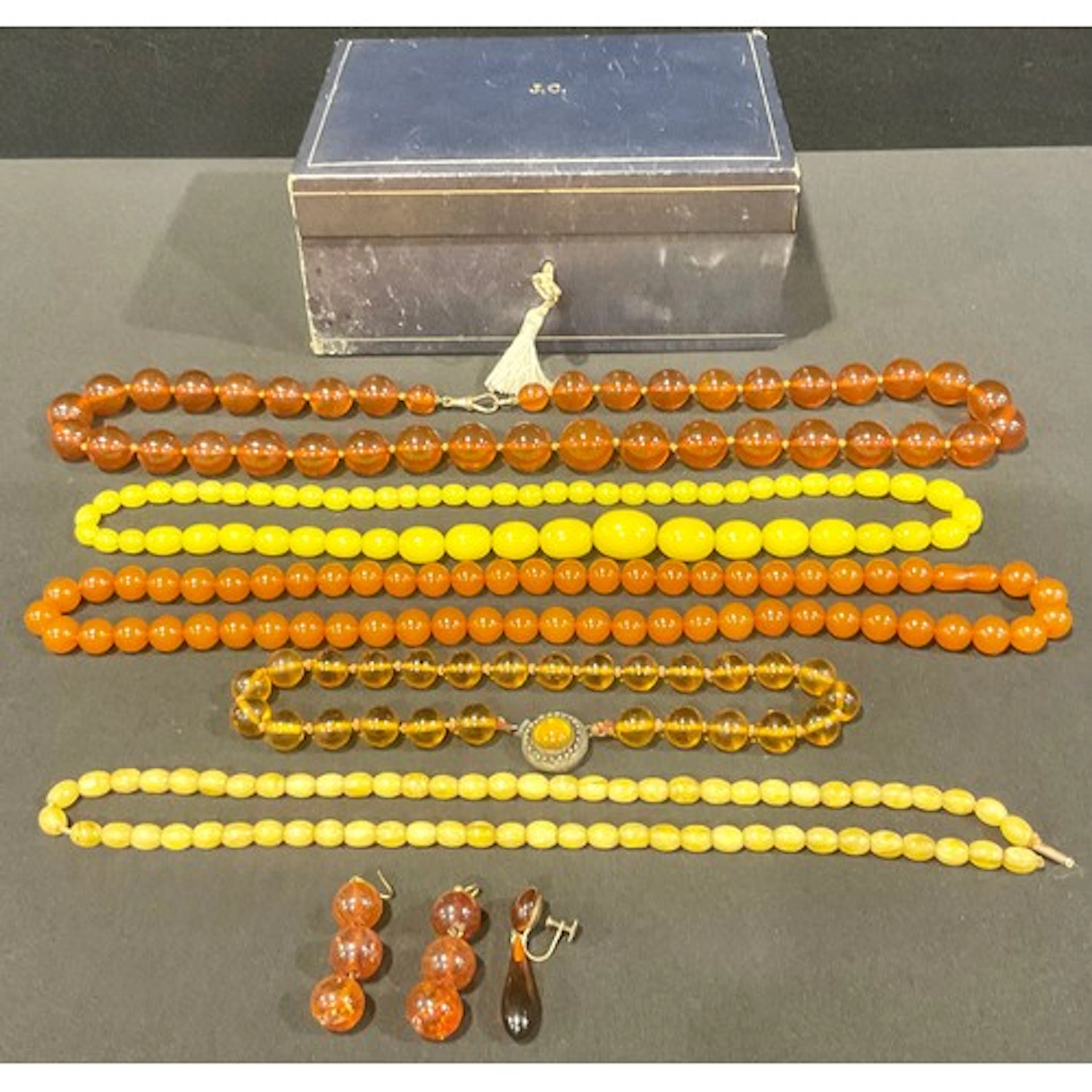 Various amber bead necklaces including Baltic amber, yellow ...