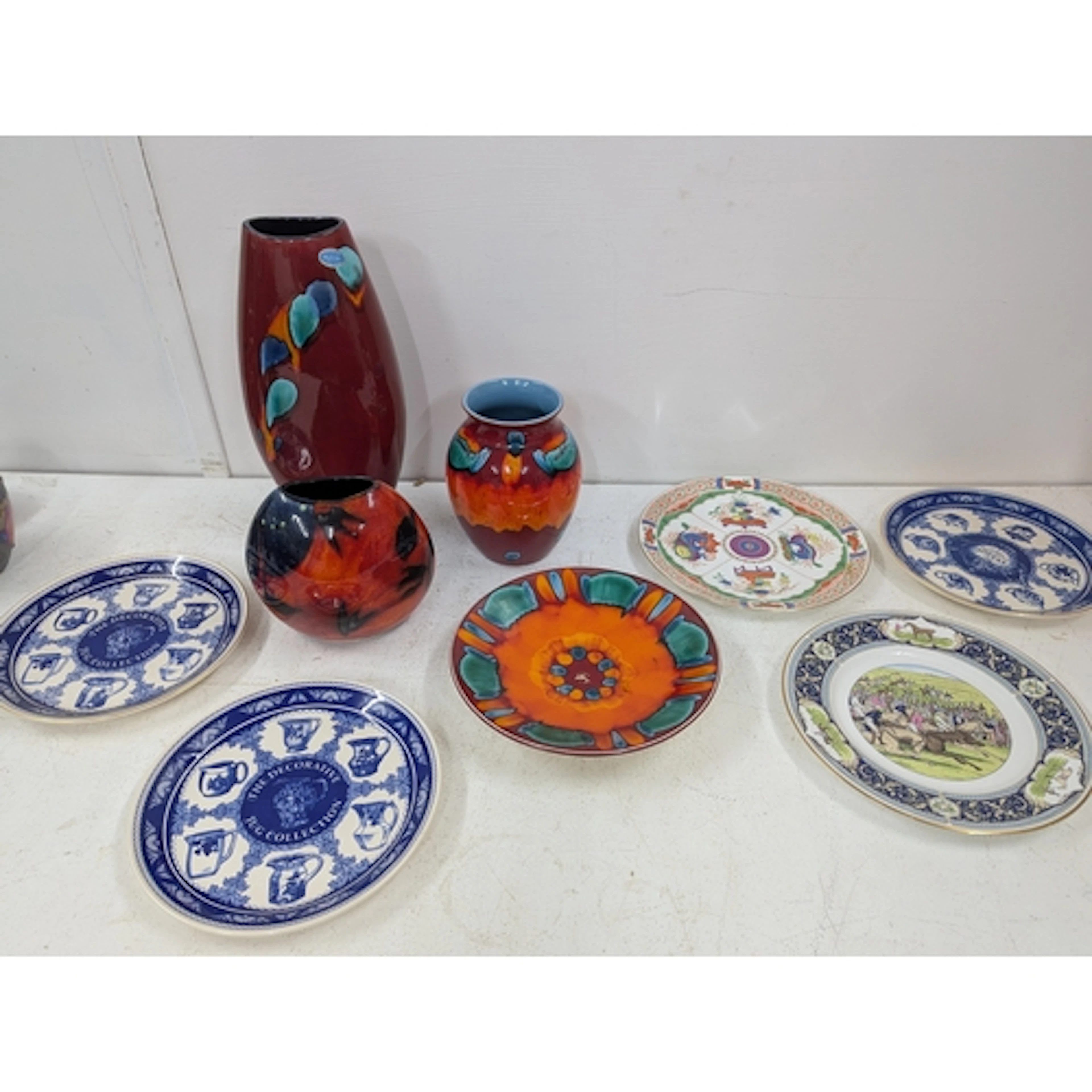 A mixed lot to include a Poole Pottery volcano vases and dis...