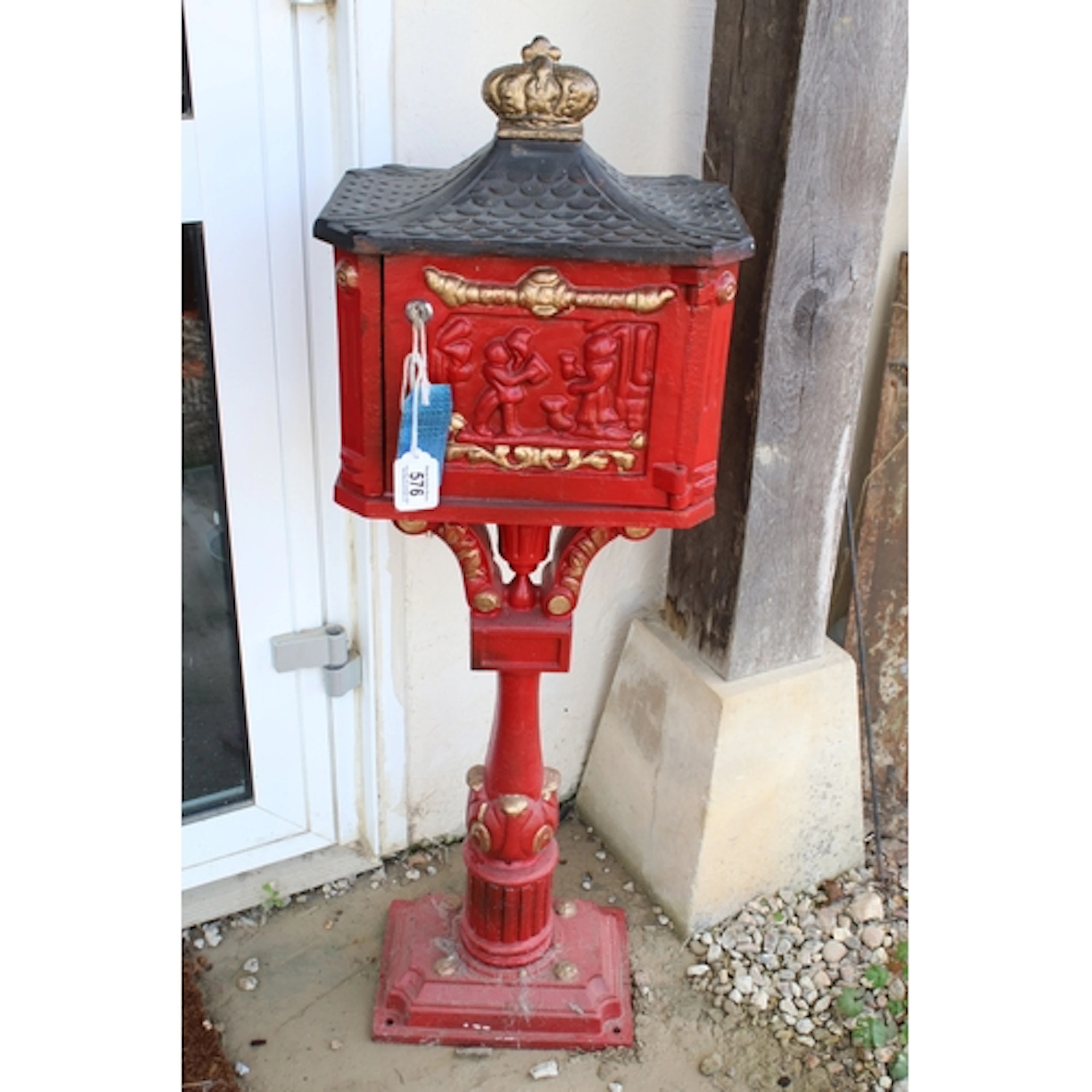20th century painted cast iron letter box, having crown fini...