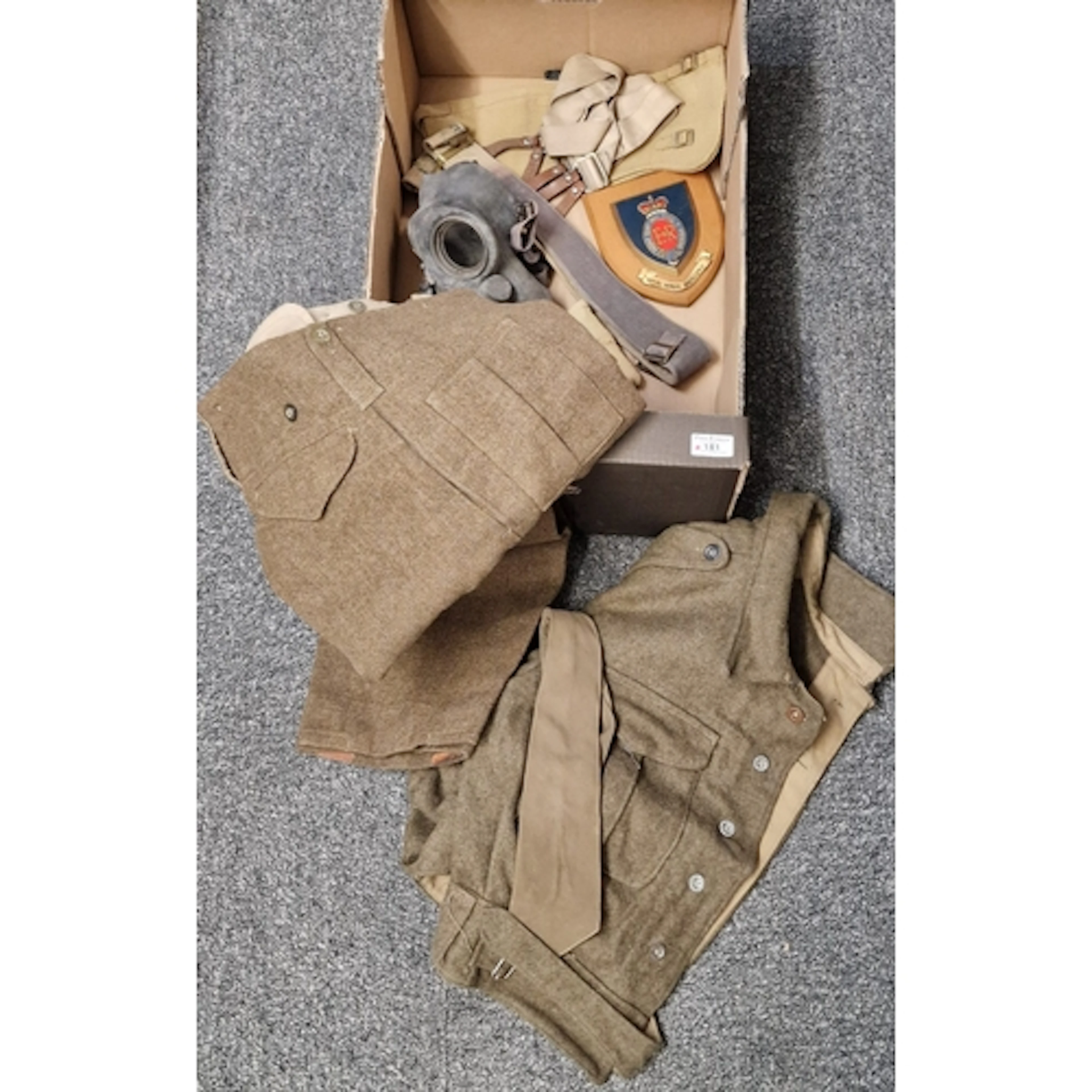 Box containing a British battledress uniform, comprising jac...