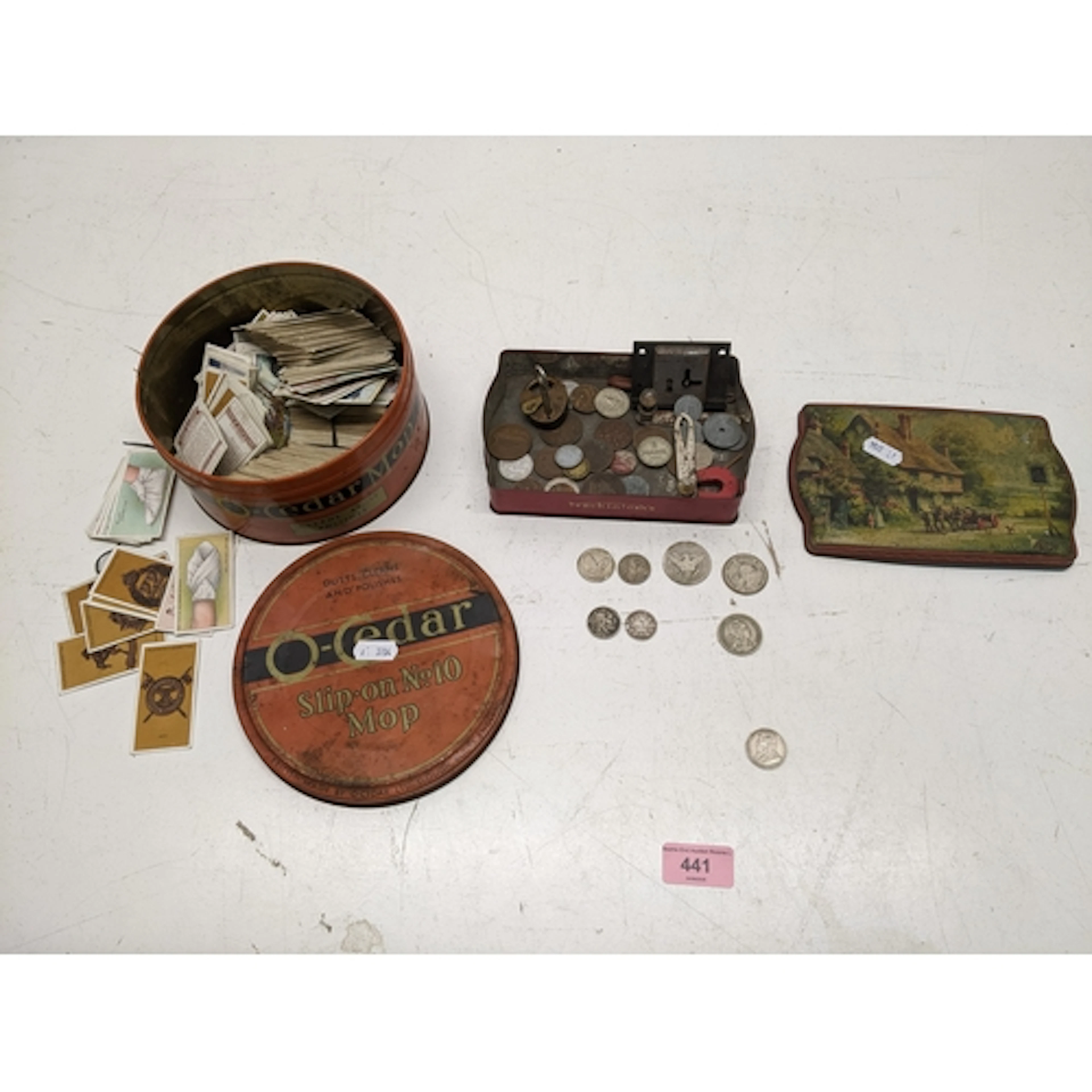 A mixed group of coins, cigarette cards and other items in t...