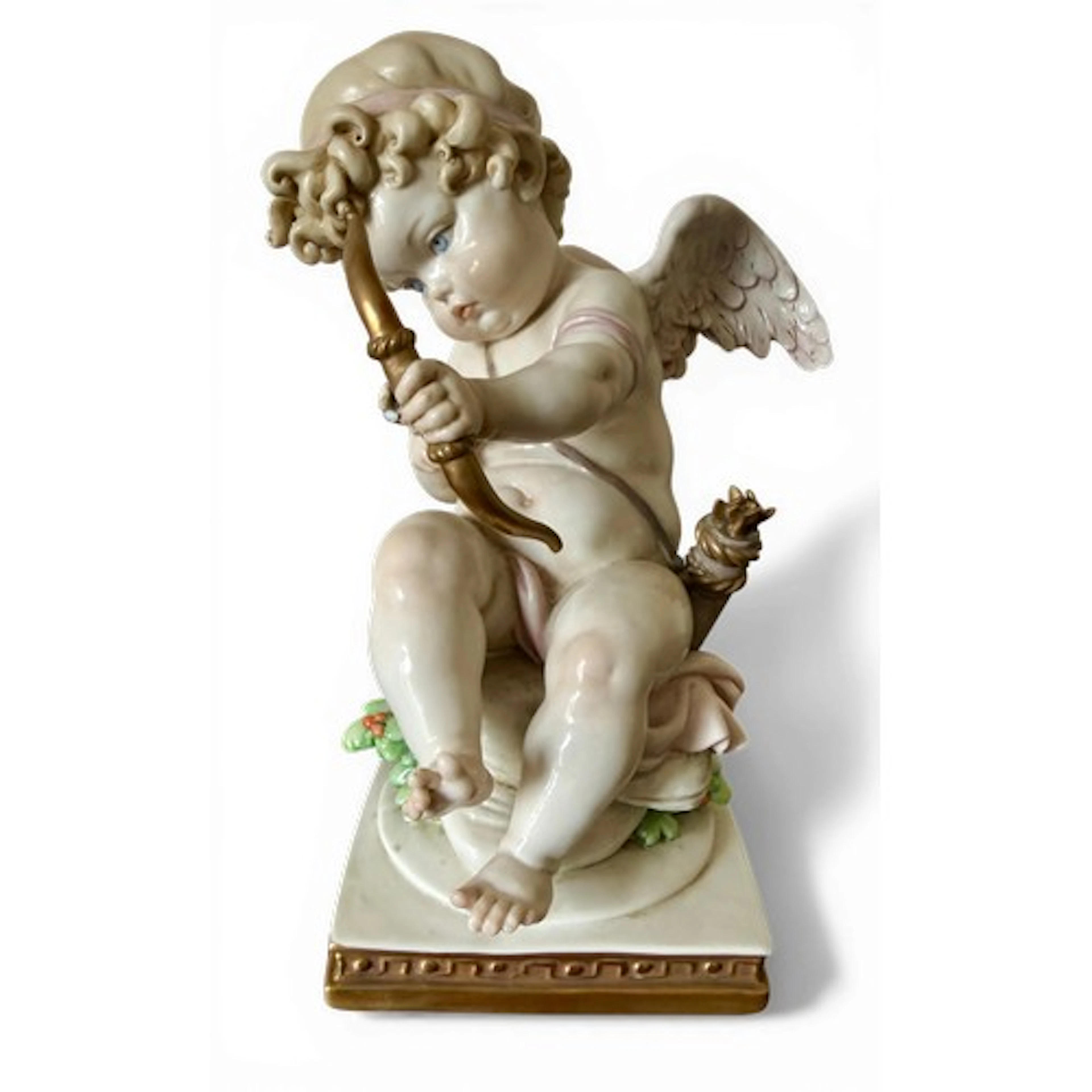 Capodimonte cherub figure with bow by Gelle, 1963. 20cm h.