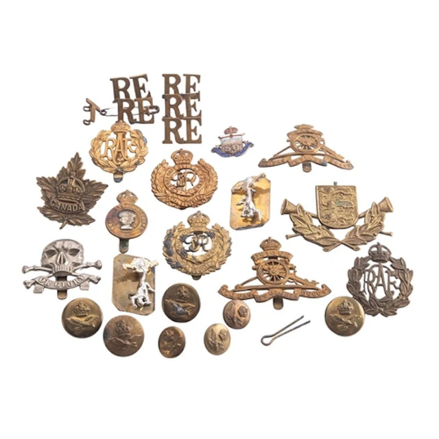 A collection of various regimental cap badges , buttons and ...