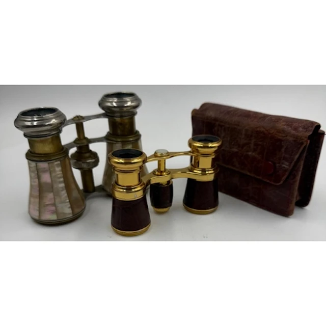 Two pairs of opera glasses one with mother of pearl inlay an...