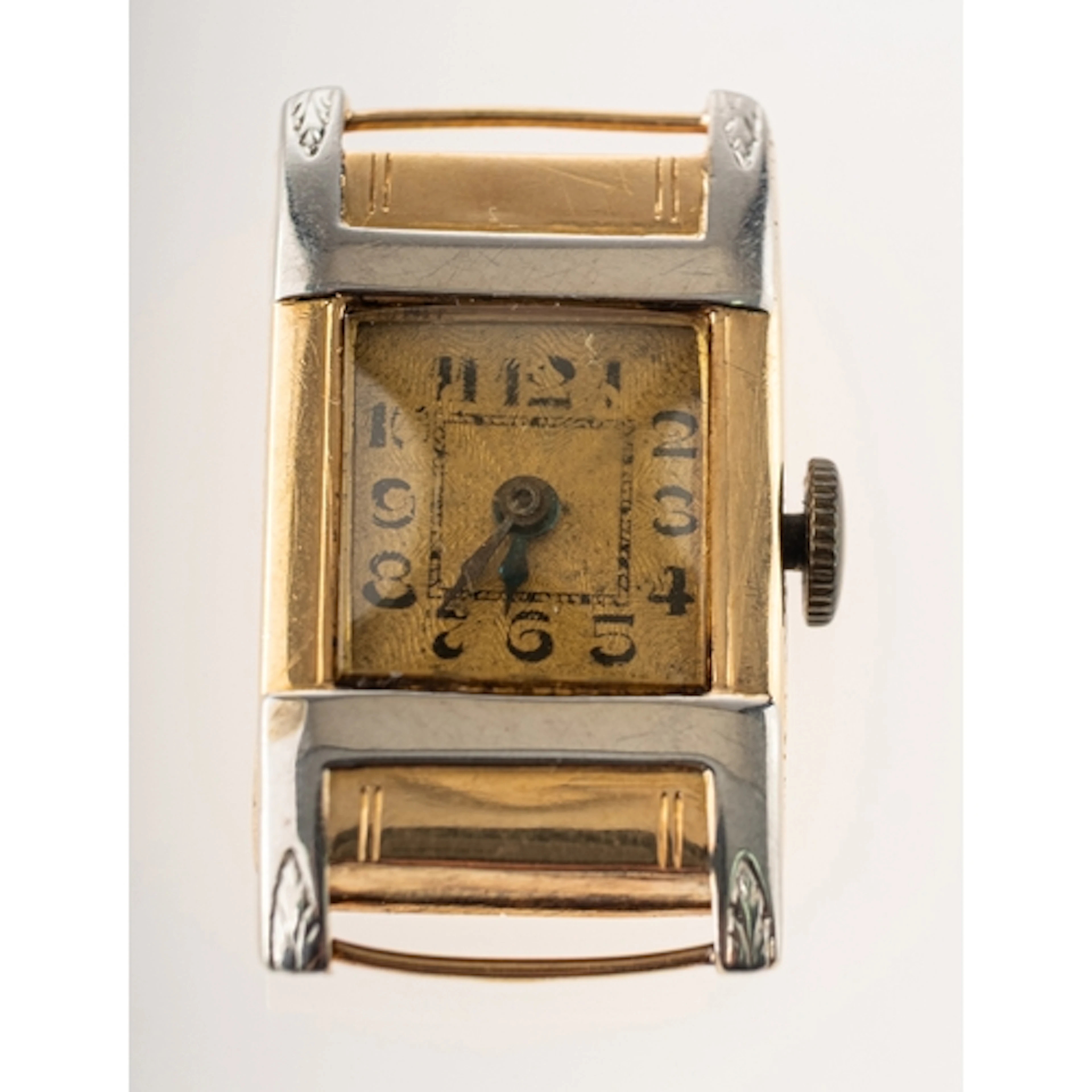 An 18ct yellow and white gold Art Deco watch the square gilt...