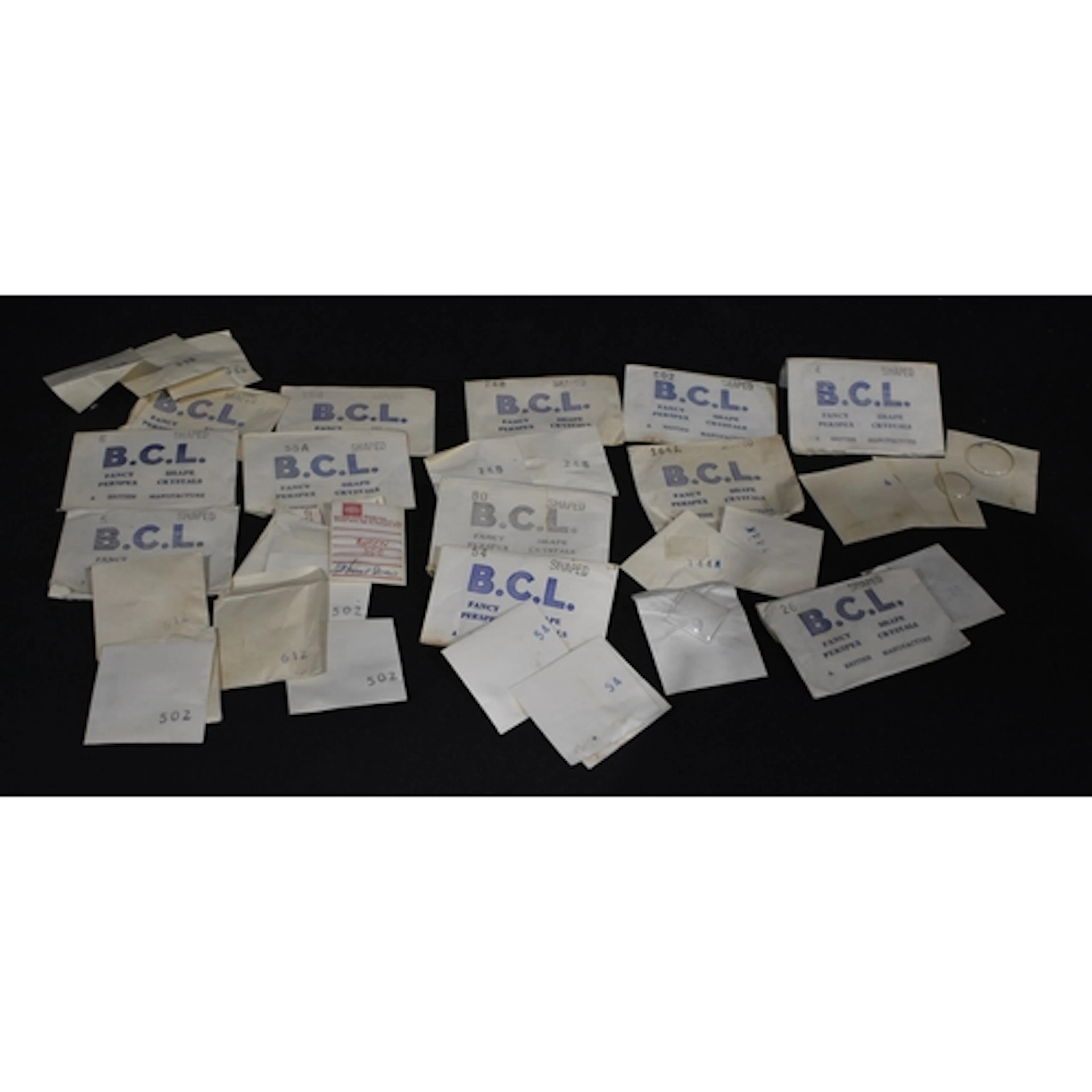 A collection of vintage Perspex watch faces (20)