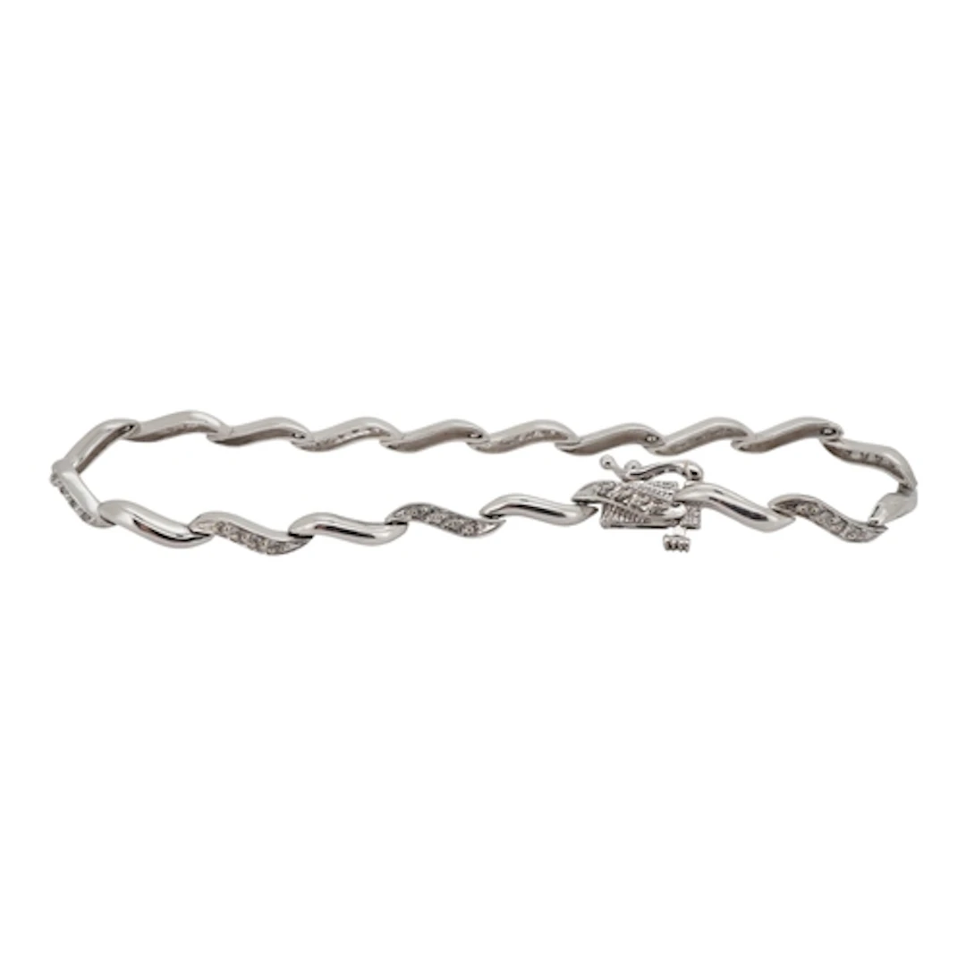 A 9ct white gold and diamond cluster set line bracelet, 18cm...