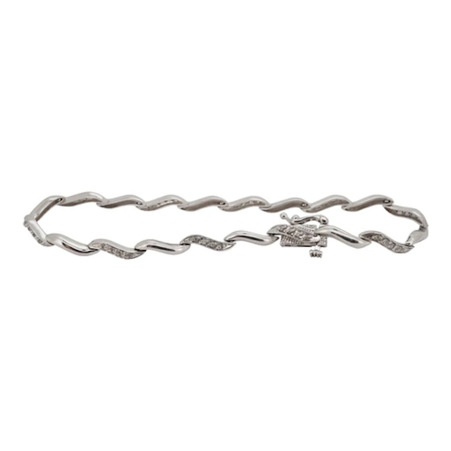 A 9ct white gold and diamond cluster set line bracelet, 18cm...