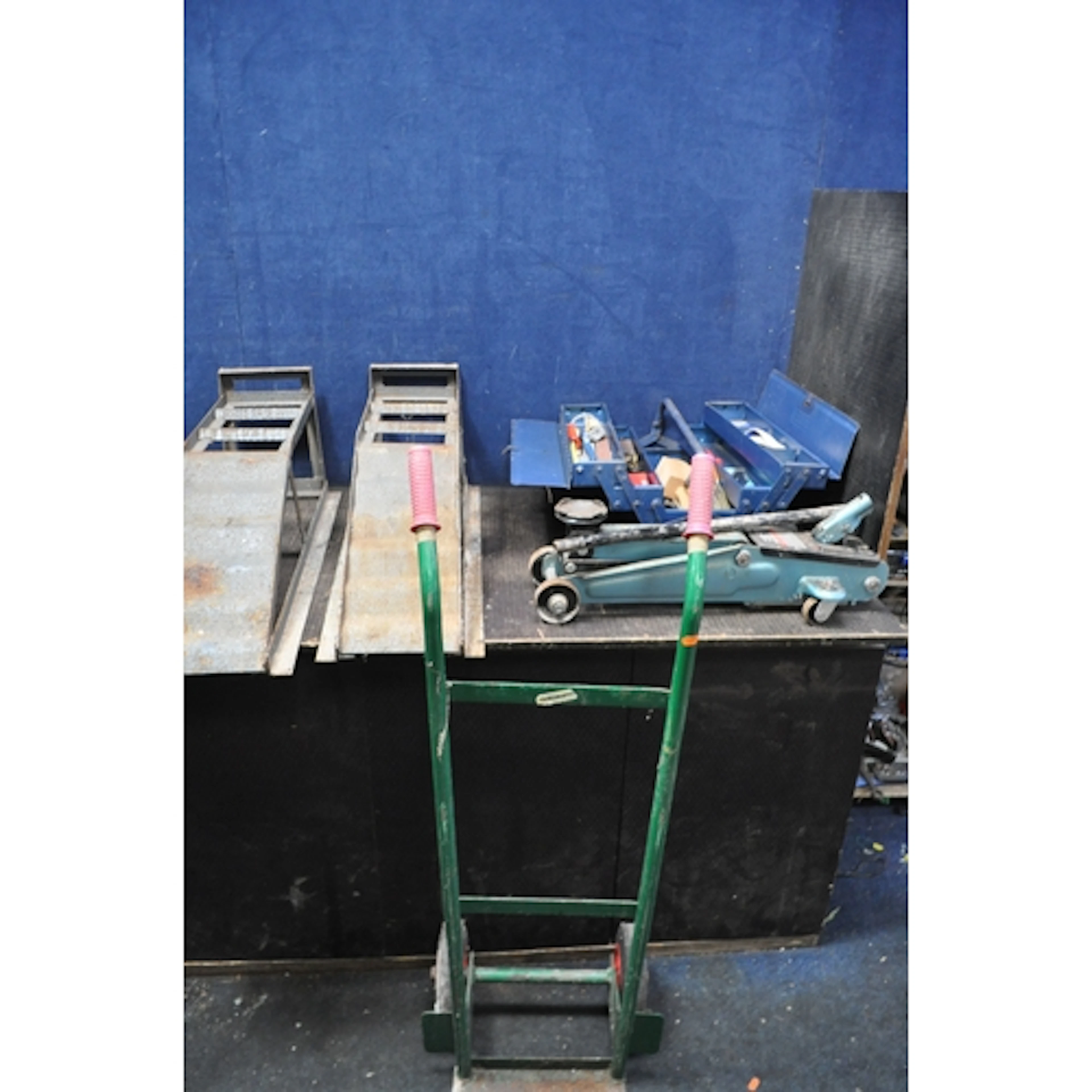 A METAL TOOLBOX, TOOLS AND RAMPS including a Halfords trolle...