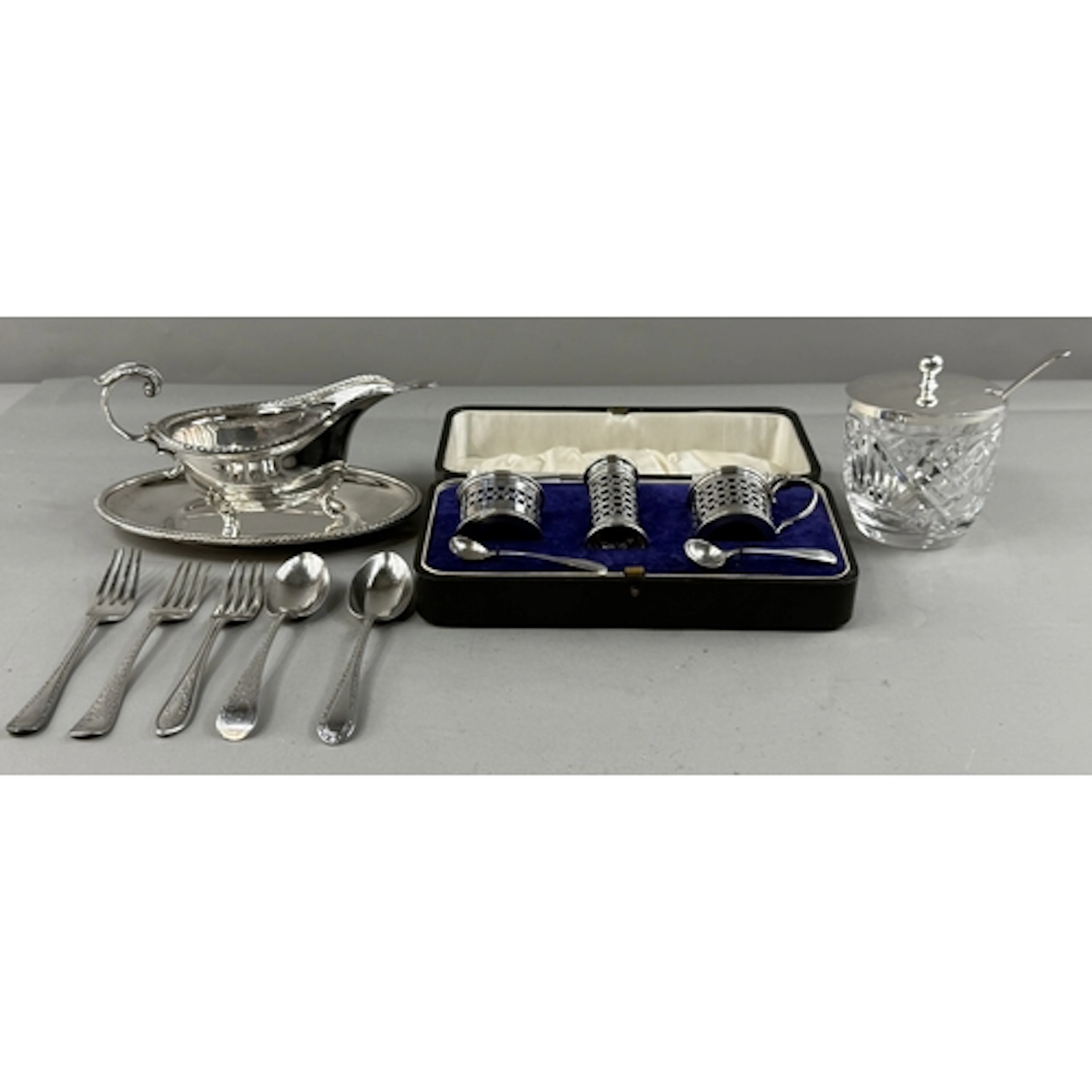 Silver: a plated Mappin and Webb sauce boat, ladle and drip ...