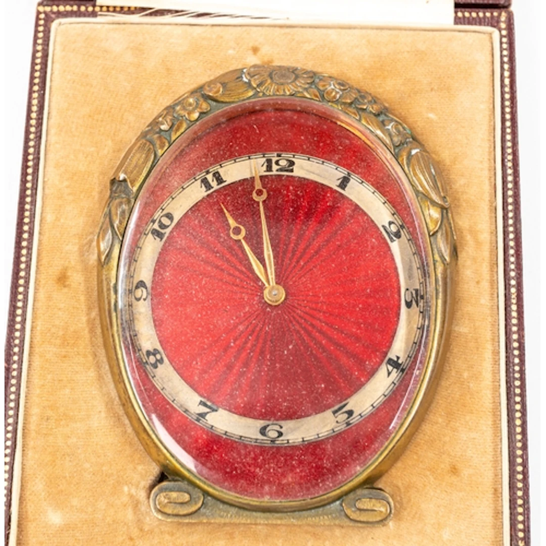 Clocks: a Tiffany & Co guilloche enamel and bronze table...
