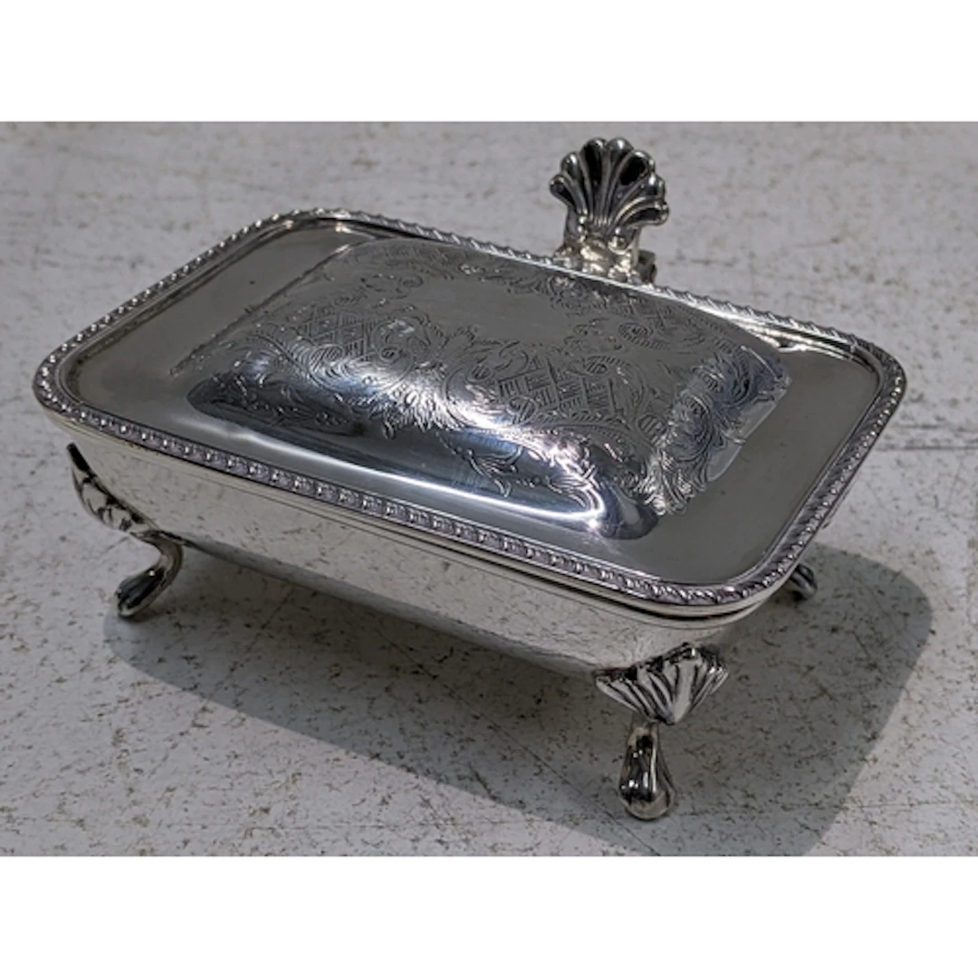 A mid 20th century silver ash tray having a hinged engraved ...