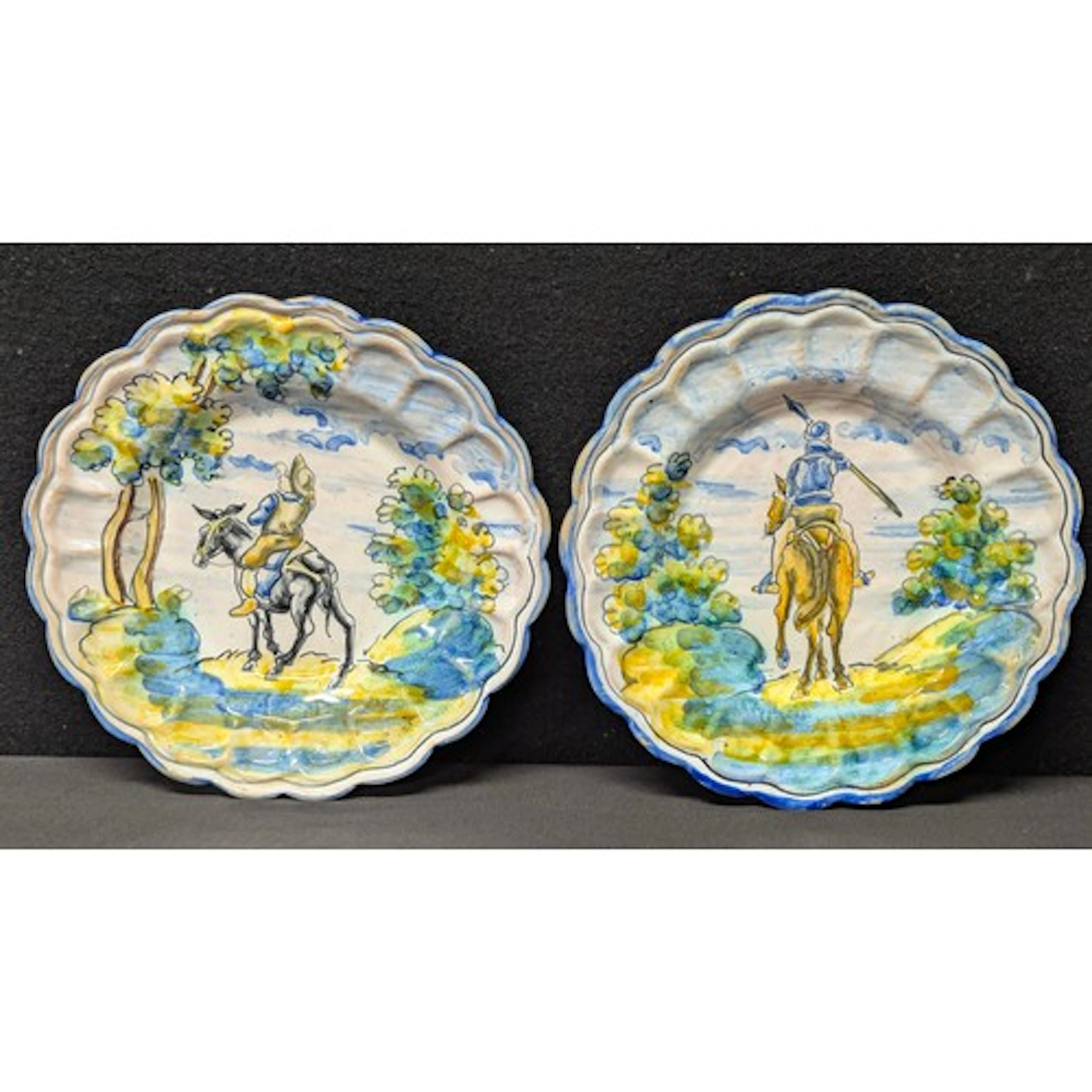 A pair of Spanish Talavera maiolica plates, painted in the I...
