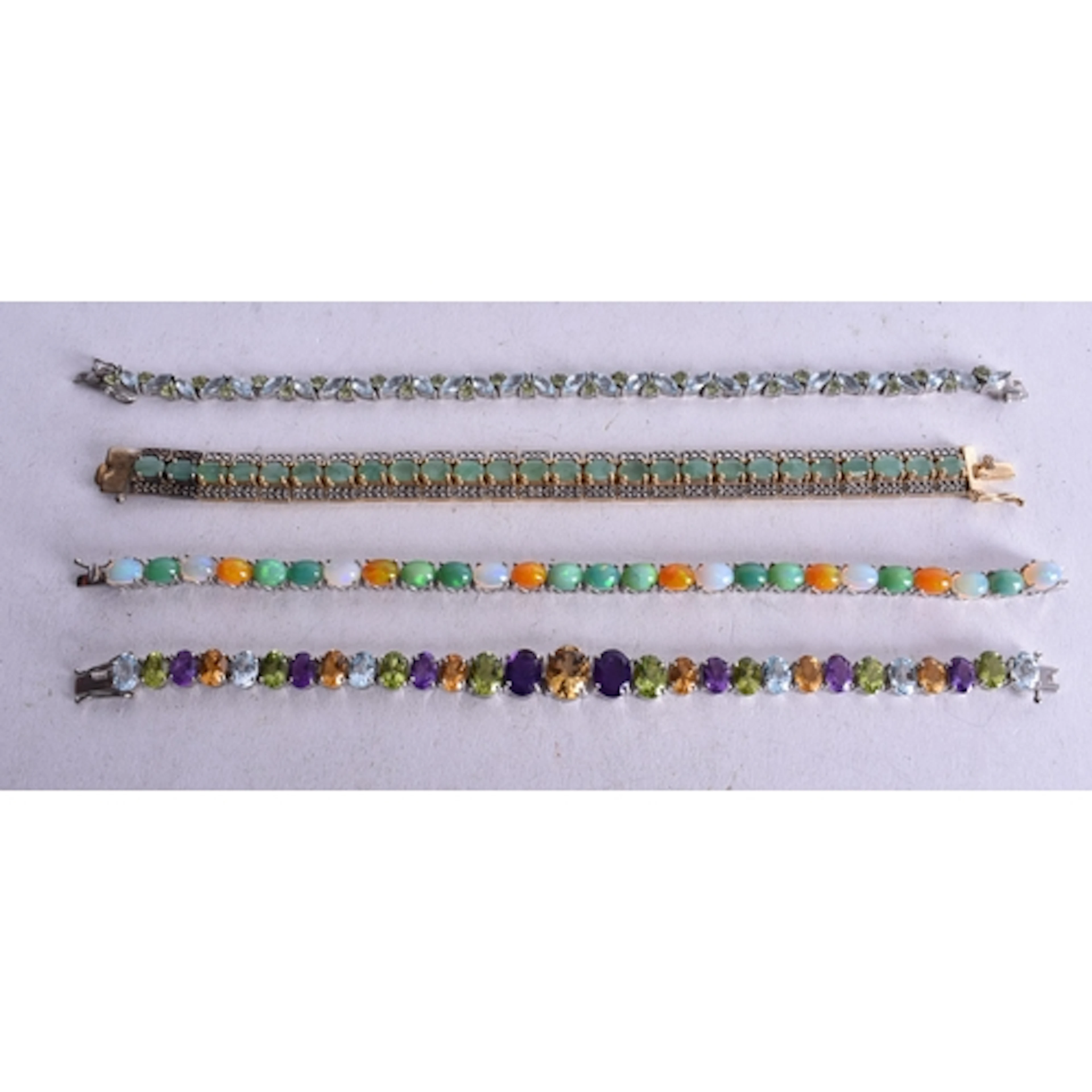 Four Sterling Silver Gemstone Bracelets inc. Emerald, Topaz...