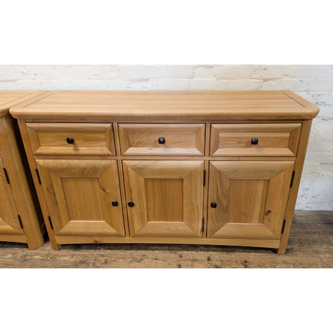 A modern good quality light oak sideboard fitted three drawe...