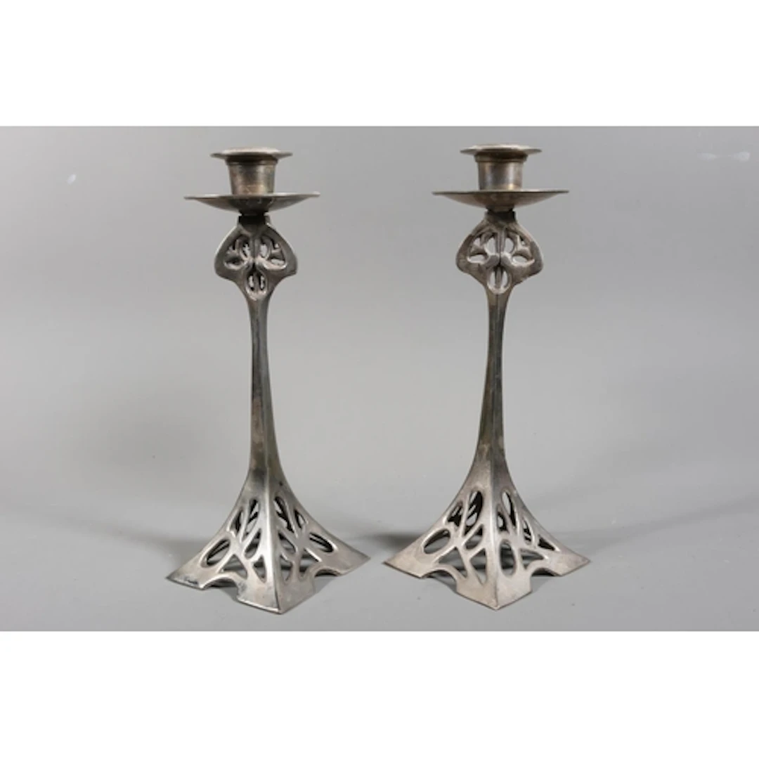 Pair of cast Art Nouveau style candlesticks, each with circu...
