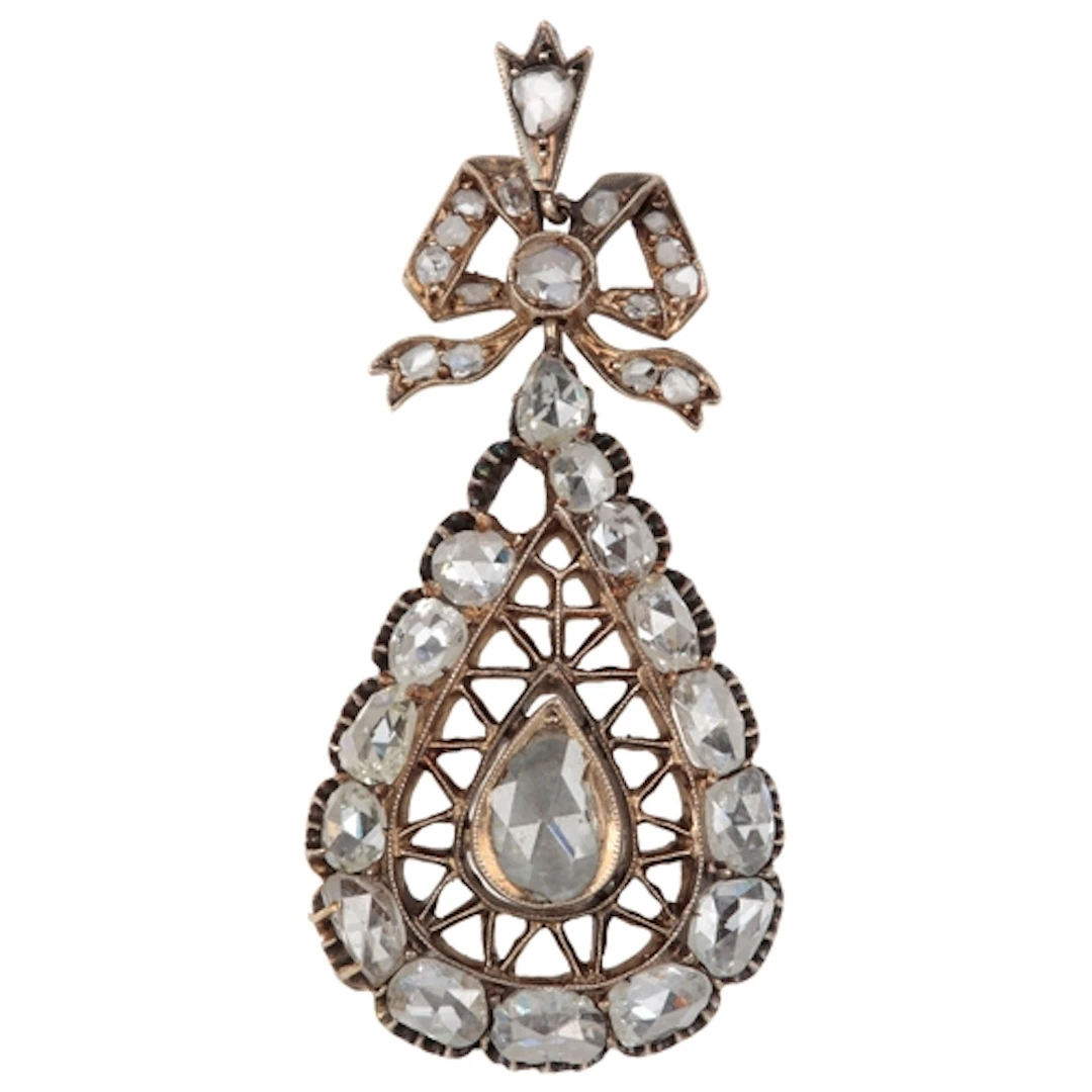 A diamond pendant, early 20th century, designed as a ribbon ...