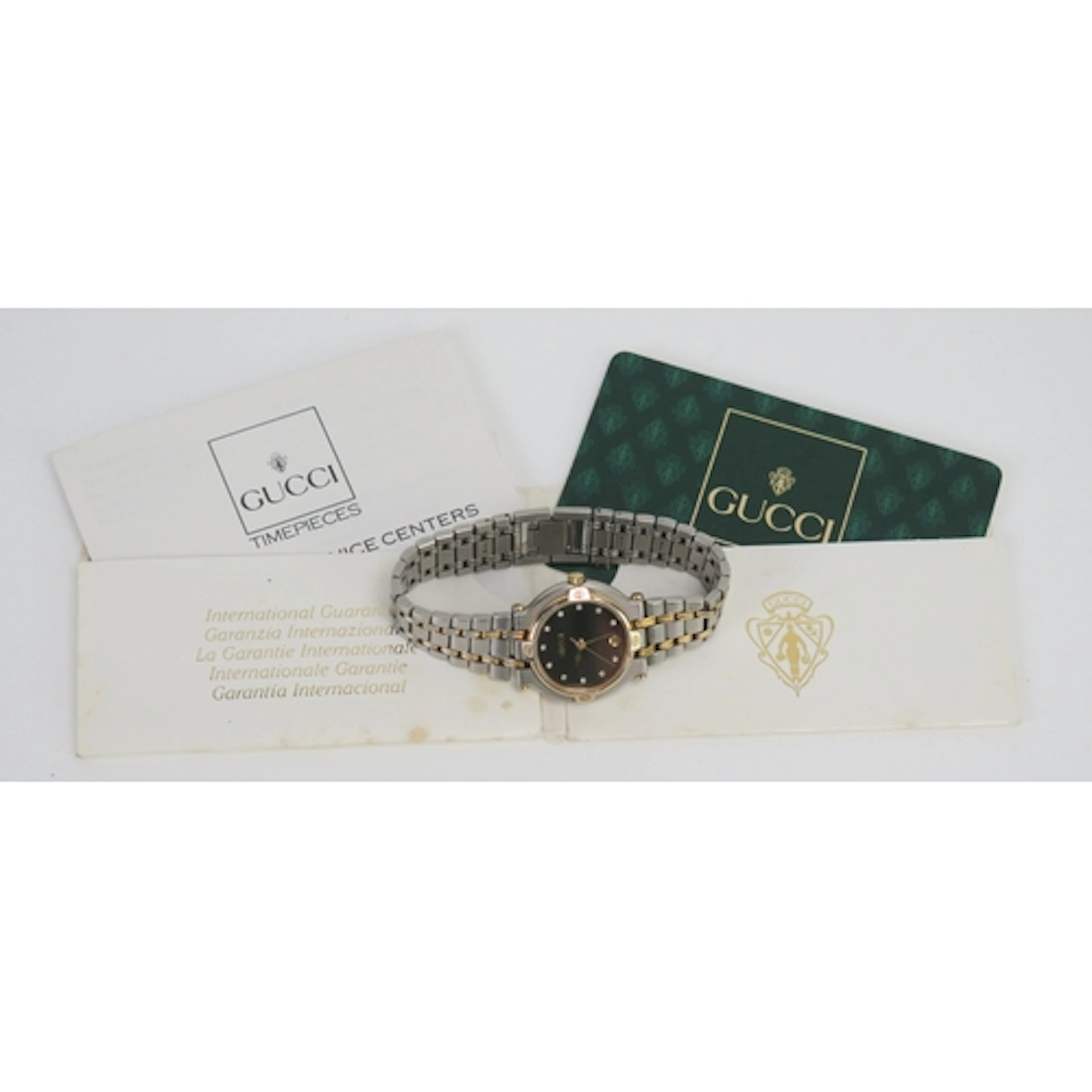 A Gucci lady's diamond bi-metal quartz wristwatch, ref: 9000...