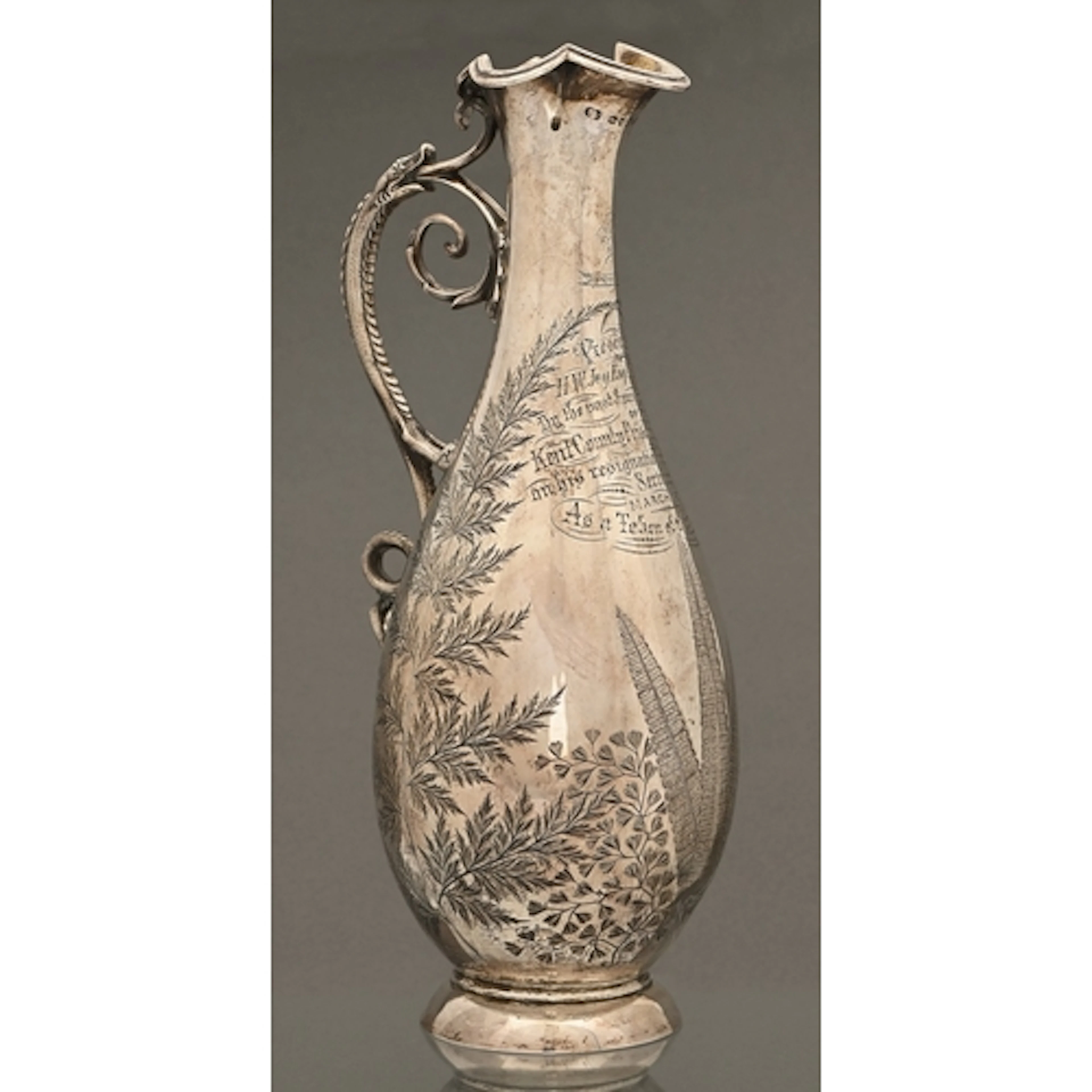 A Victorian silver claret jug, with grotesque animal handle ...