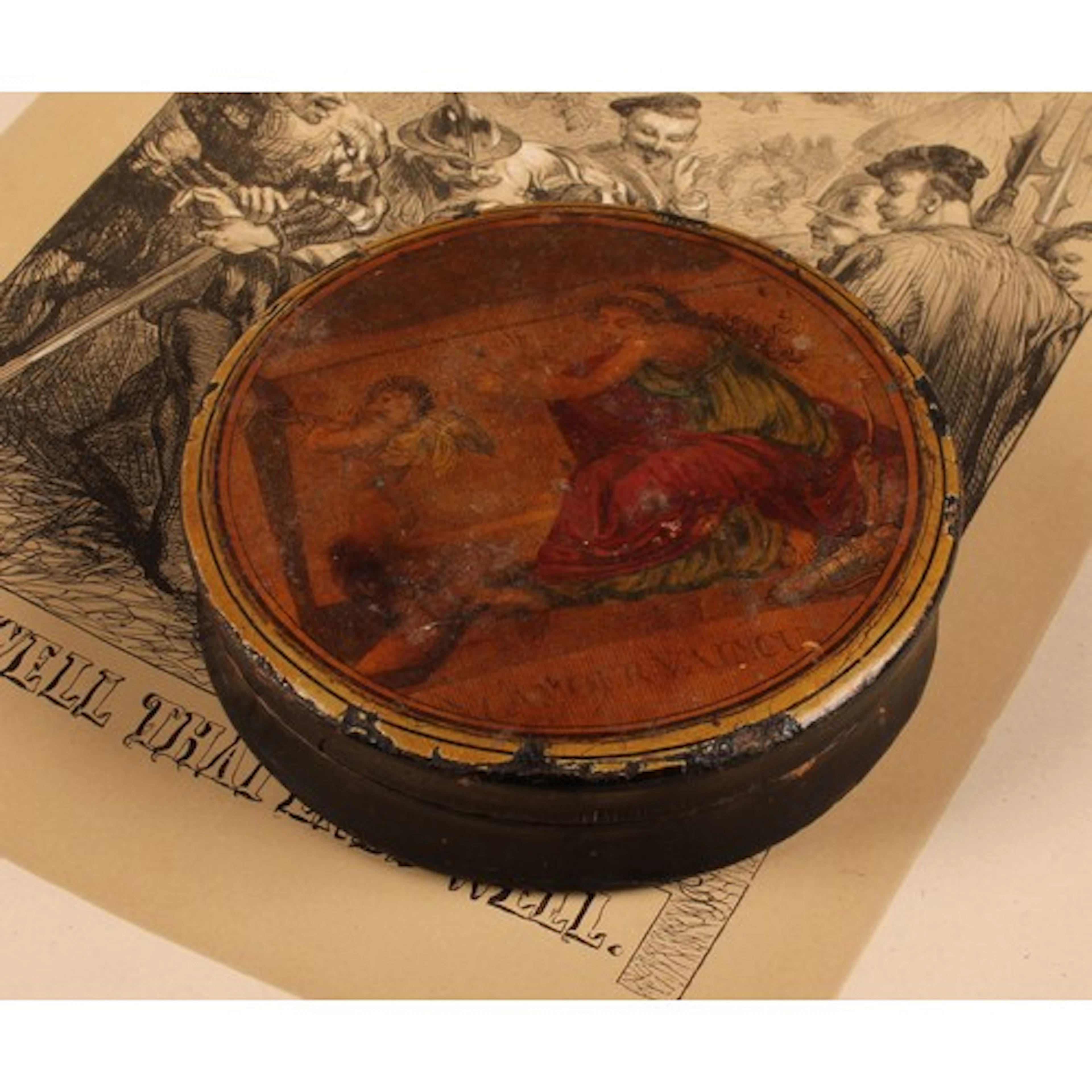 A George III papier mache circular snuff box, the press clos...