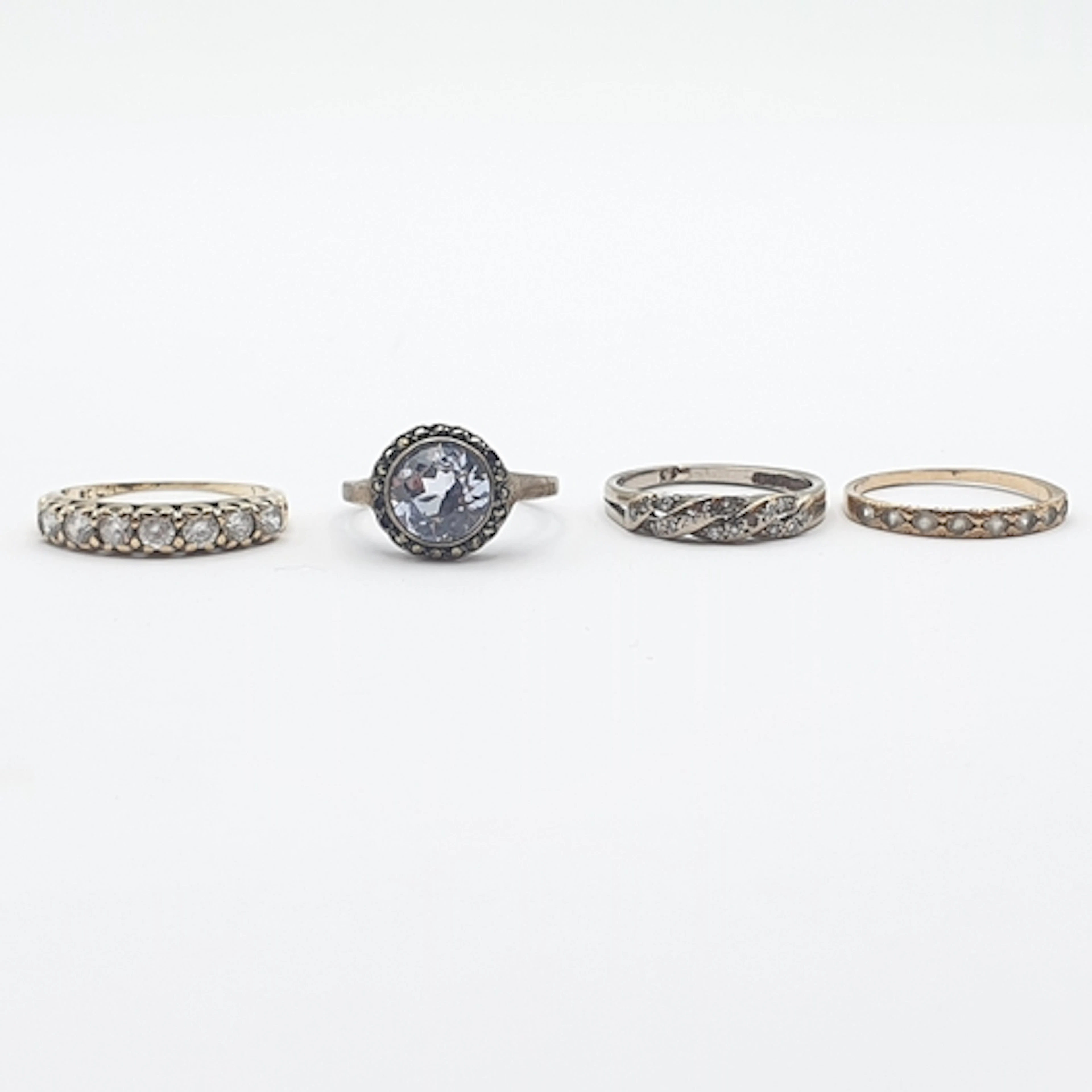 Two Rings marked 9ct set white stones, a Ring set diamonds (...
