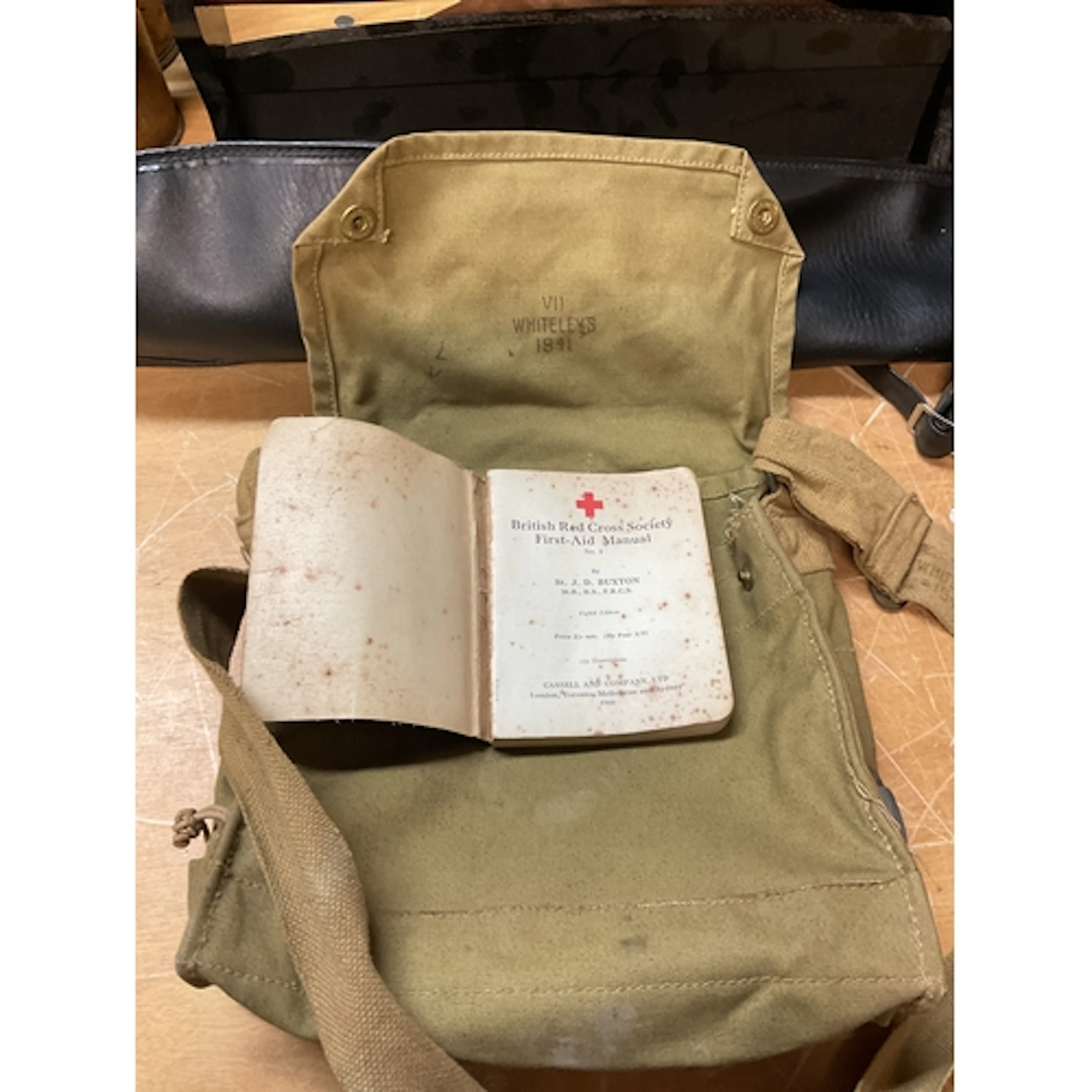 WWII 1941 Whiteleys stamped bag, with 1944 Red Cross manual.