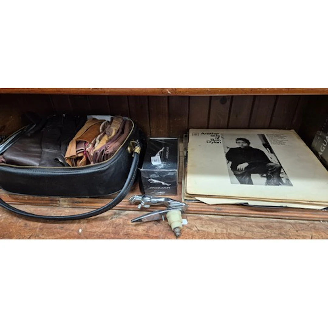 A Jaguar car mascot, a vanity case of leather gloves togethe...