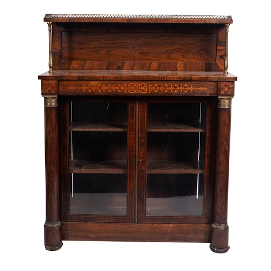 A Regency rosewood chiffonier, circa 1815; the raised shelf ...