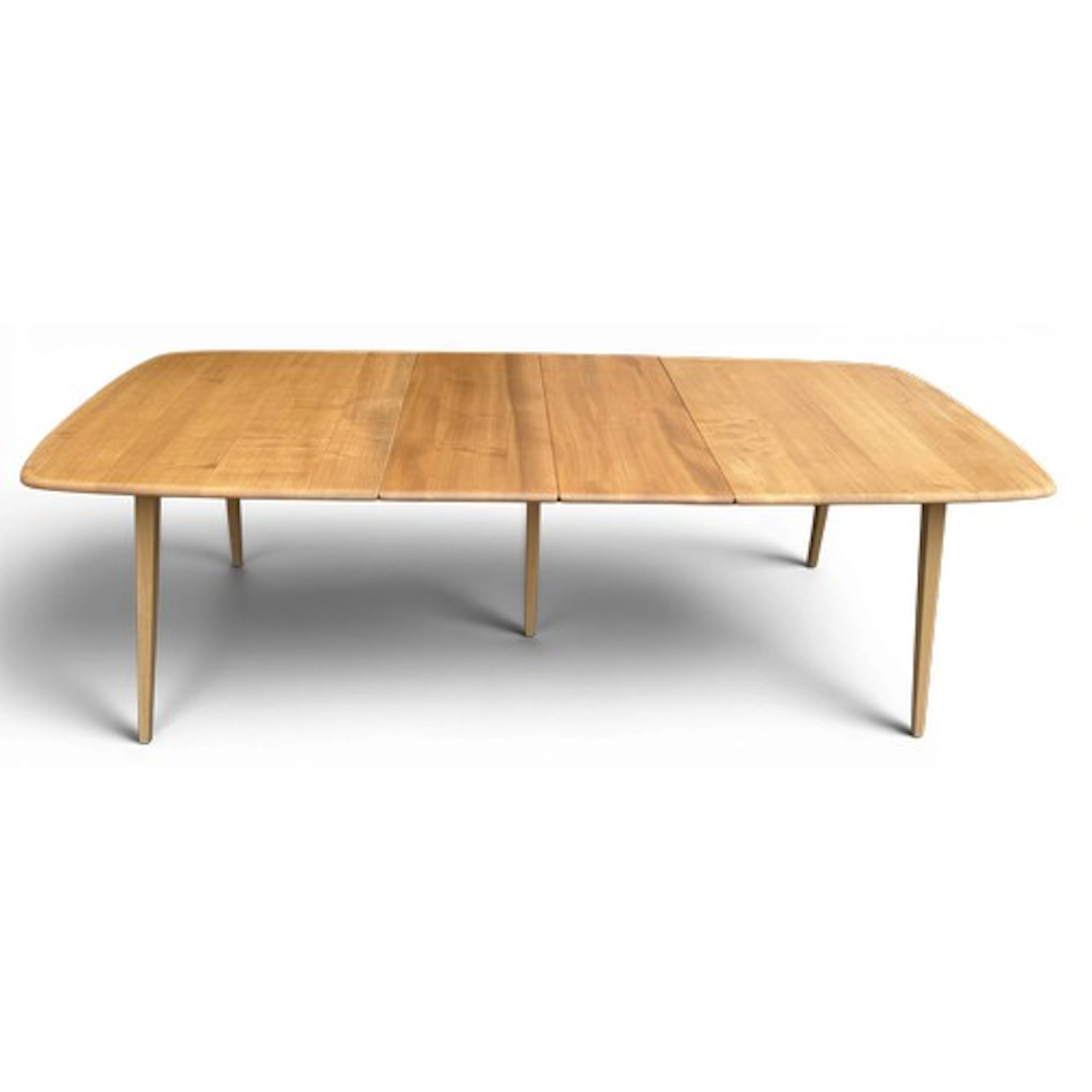A mid 20thC Ercol Windsor extending dining table. 204cm l ex...