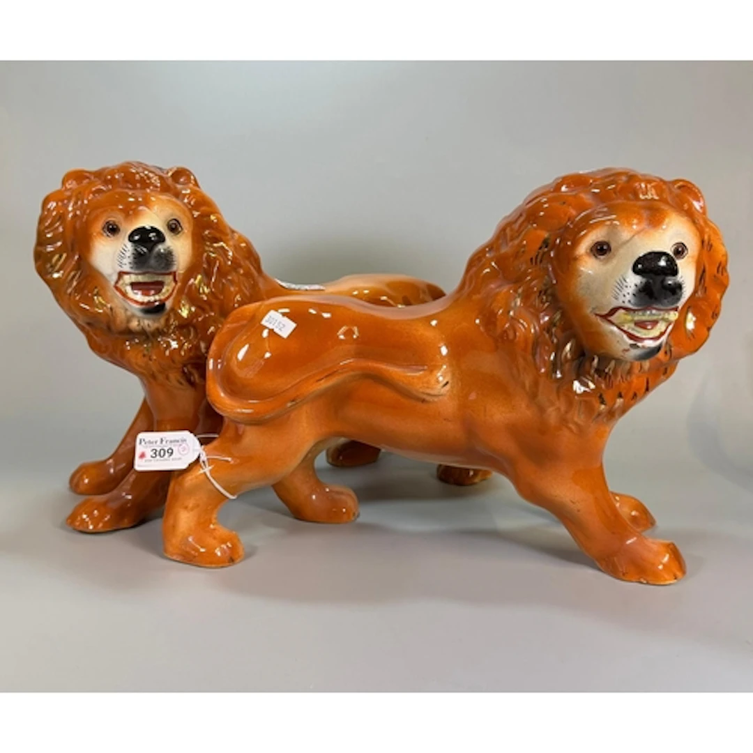 Pair of early 20th century Staffordshire fireside male lions...