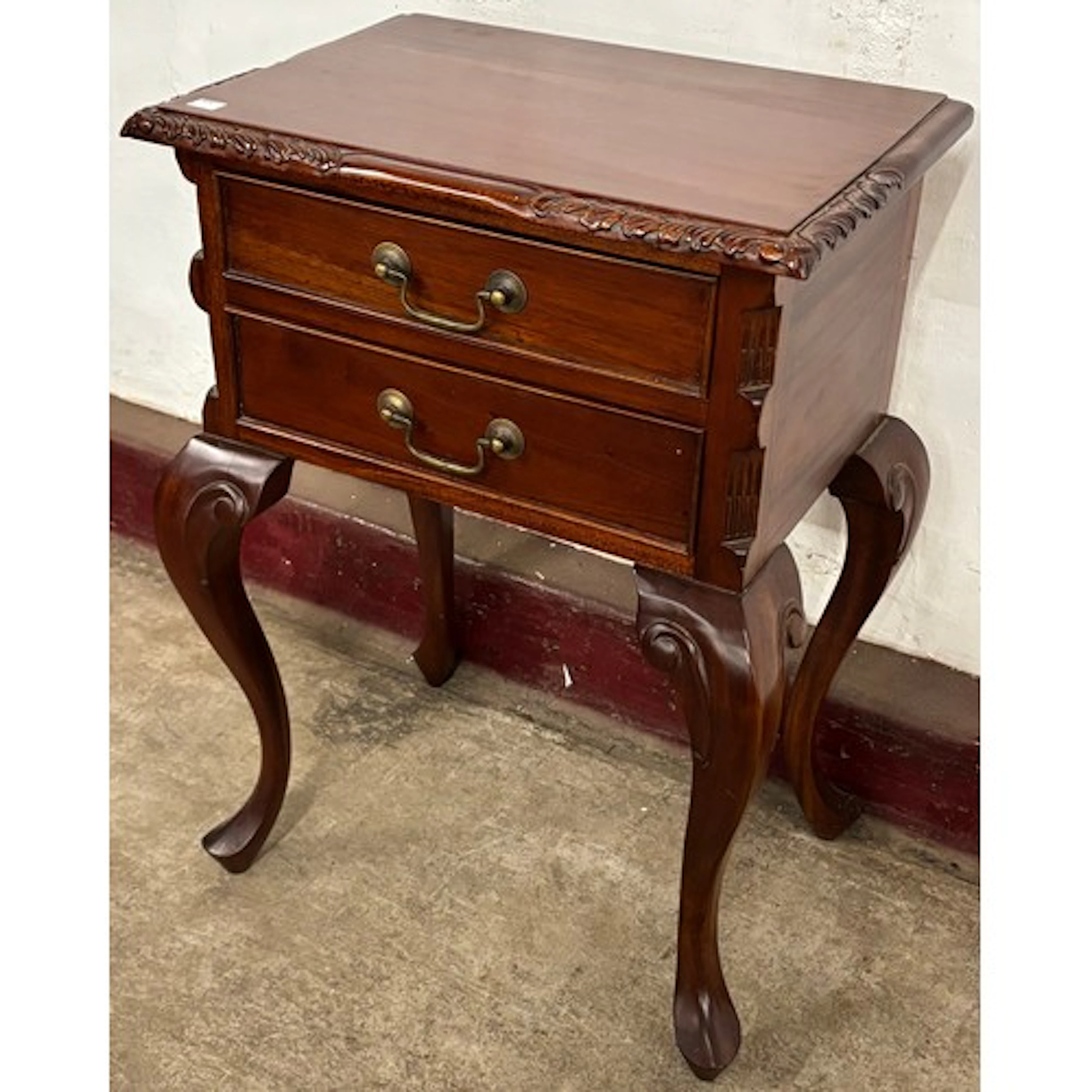 A Chippendale style hardwood bedside table