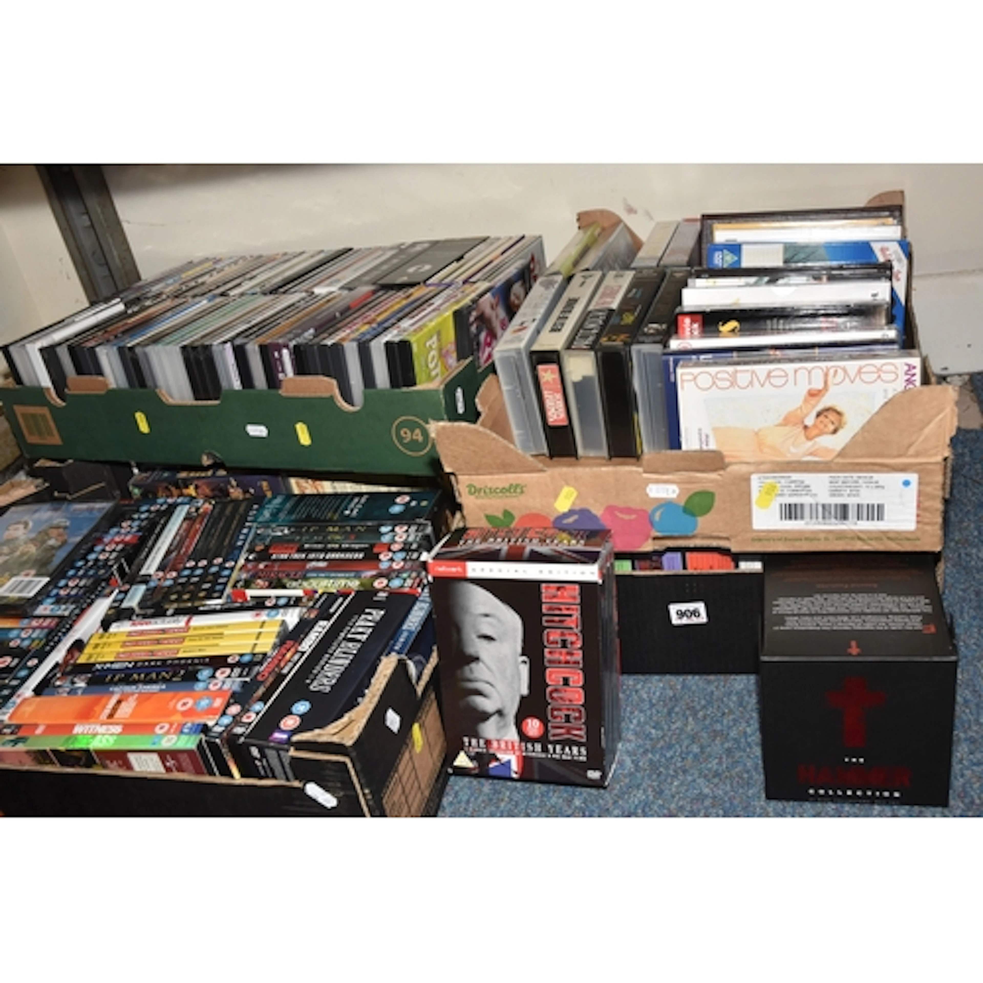 FIVE BOXES OF DVDS AND VHS TAPES, to include approximately o...