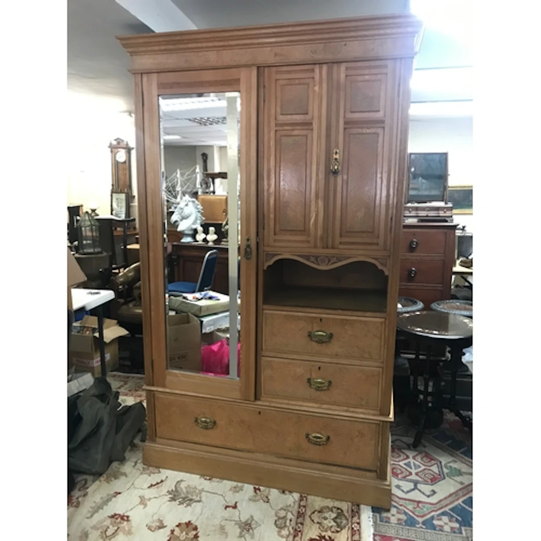 A large combination wardrobe featuring a single mirrored doo...