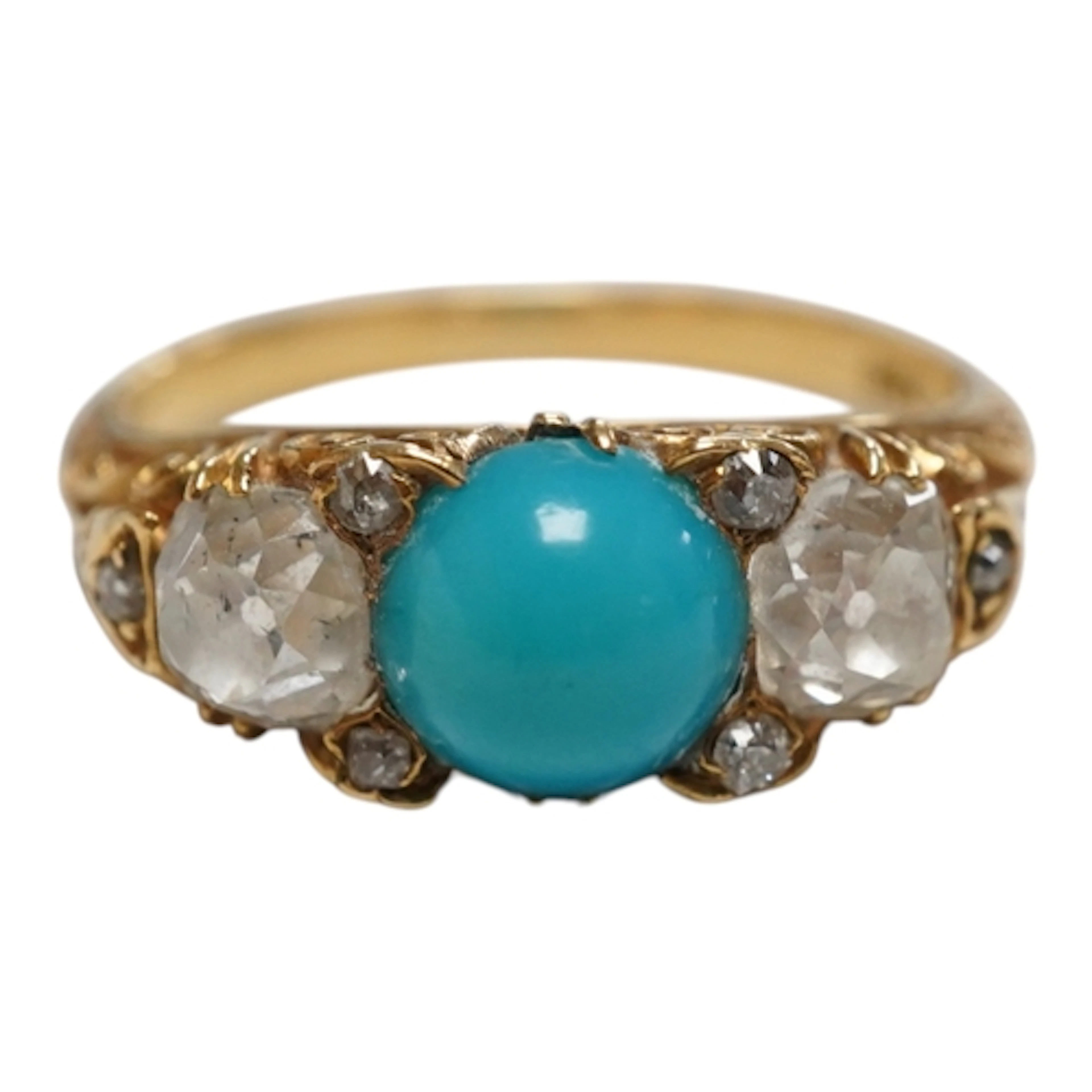 A yellow metal, single stone turquoise and two stone diamond...