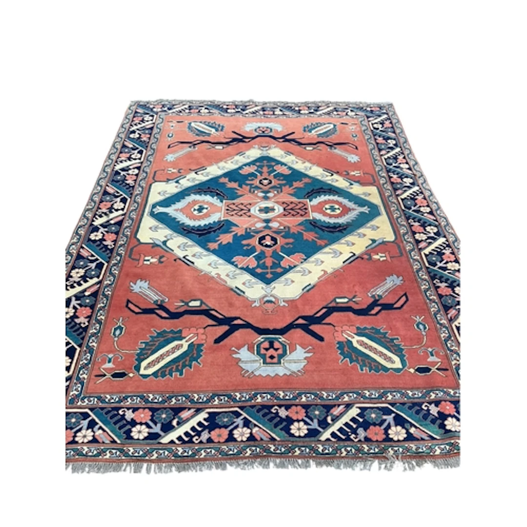 A Turkish red ground geometric carpet, 295 x 219cm
