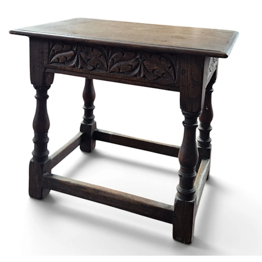 A 19th Century Oak Stool on turned supports and stretcher ba...