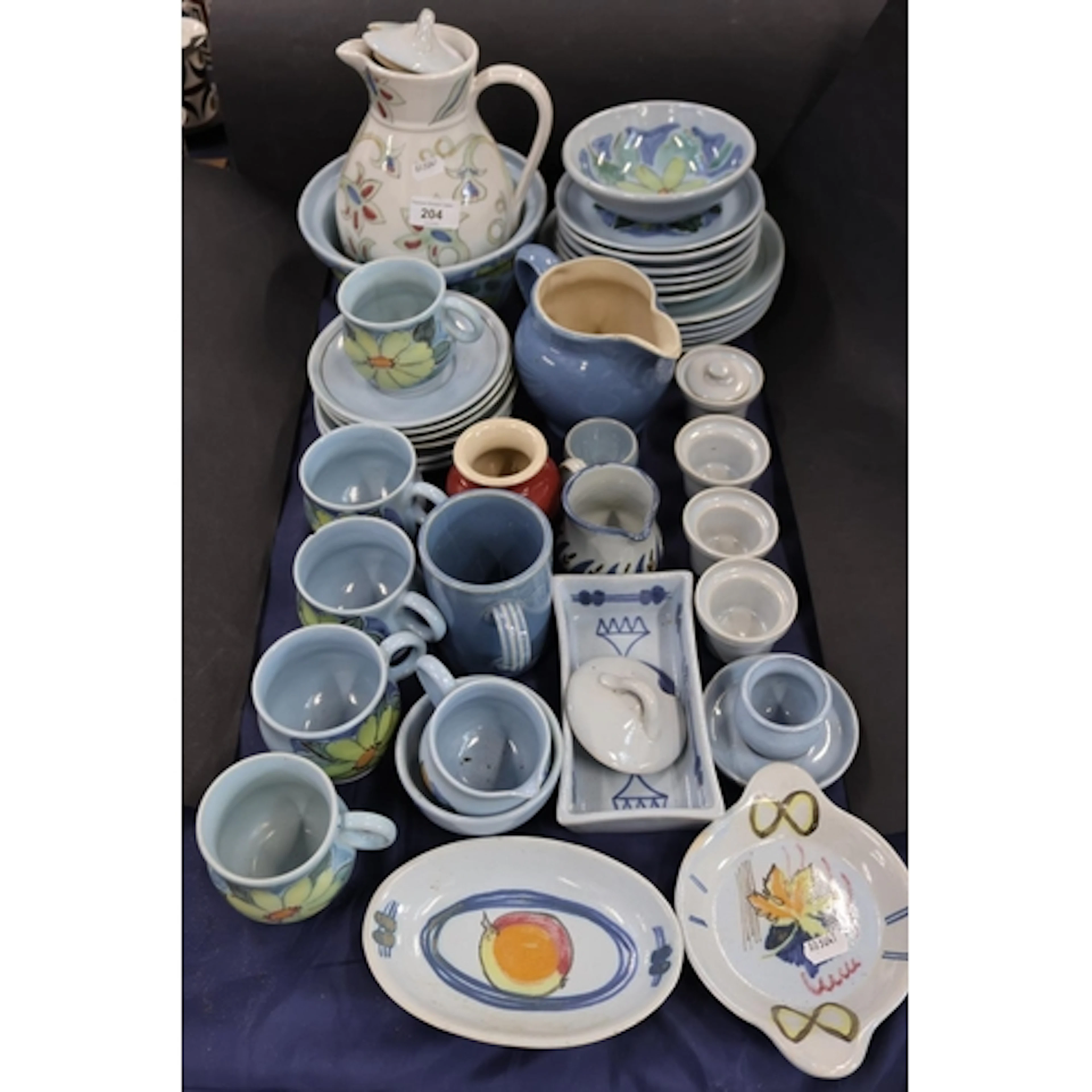 Buchan ware including cups, dishes, bowls, water jugs, etc.