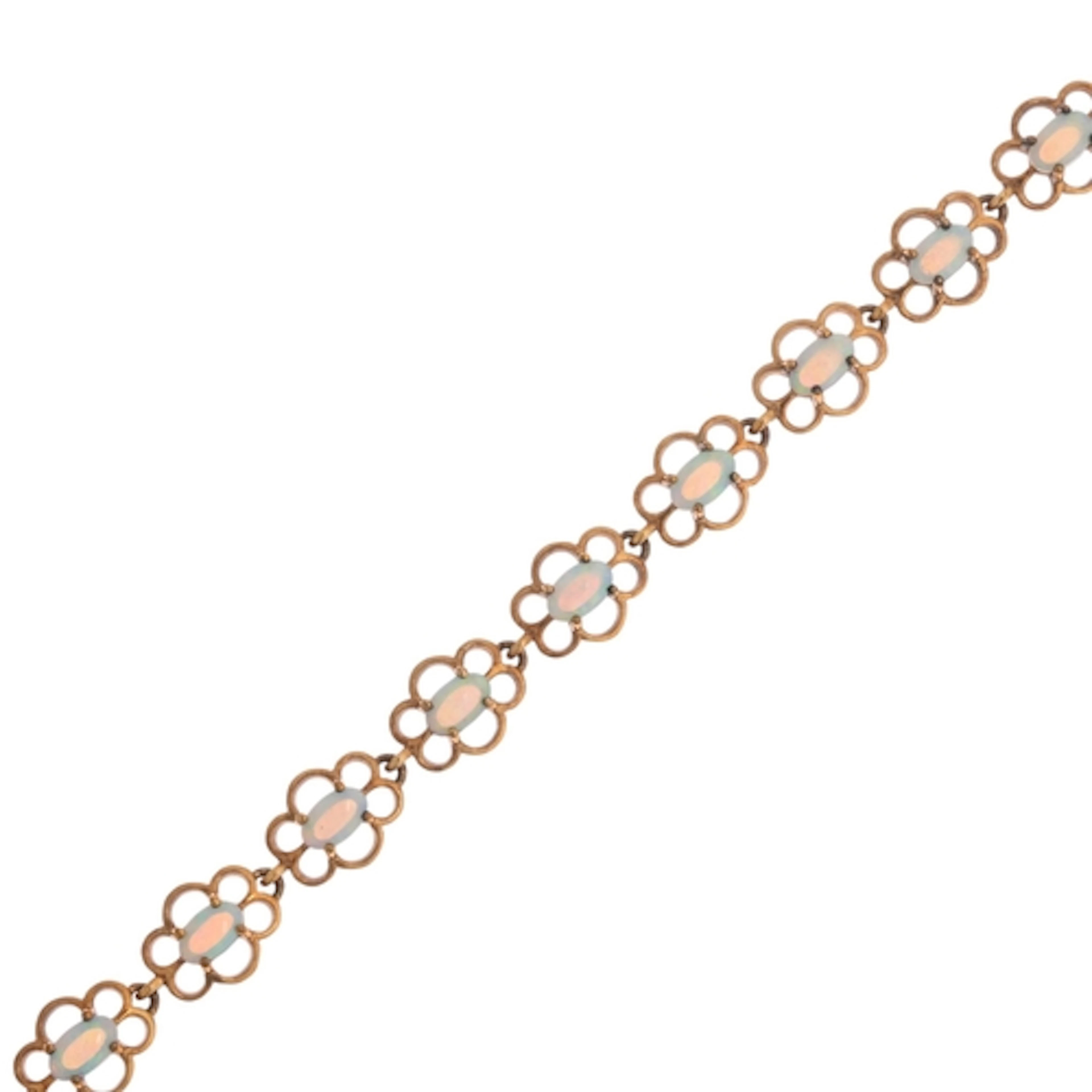 A 9ct gold jelly opal line bracelet, claw set with oval cabo...