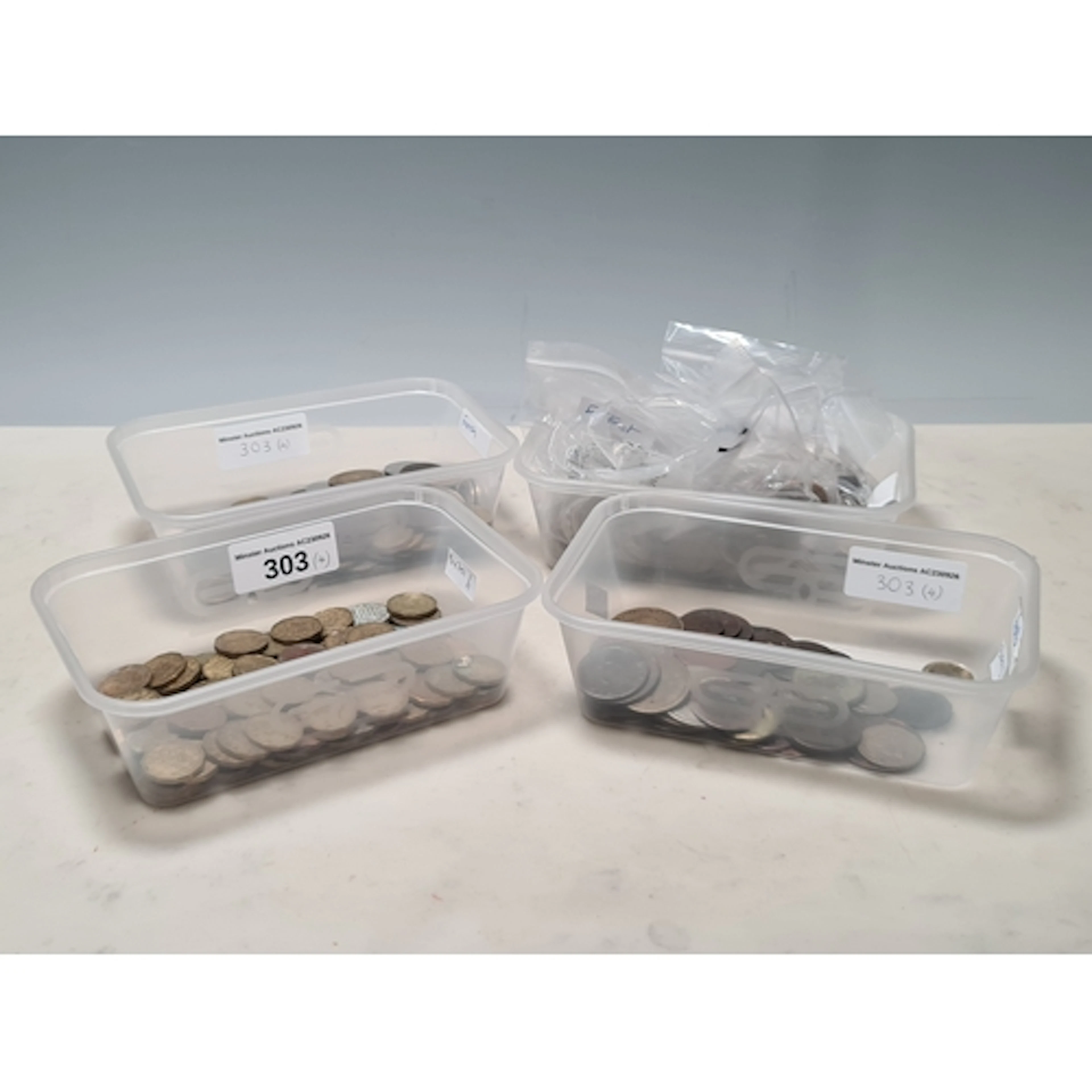 Four tubs of British and World Coins, to include a Queen Ann...