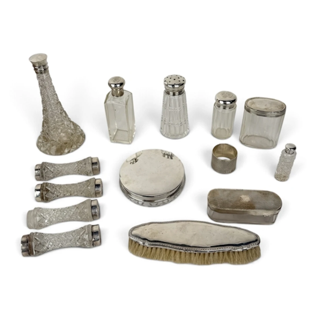 A COLLECTION OF SILVER SCENT BOTTLES, SILVER TOPPED BOTTLES,...