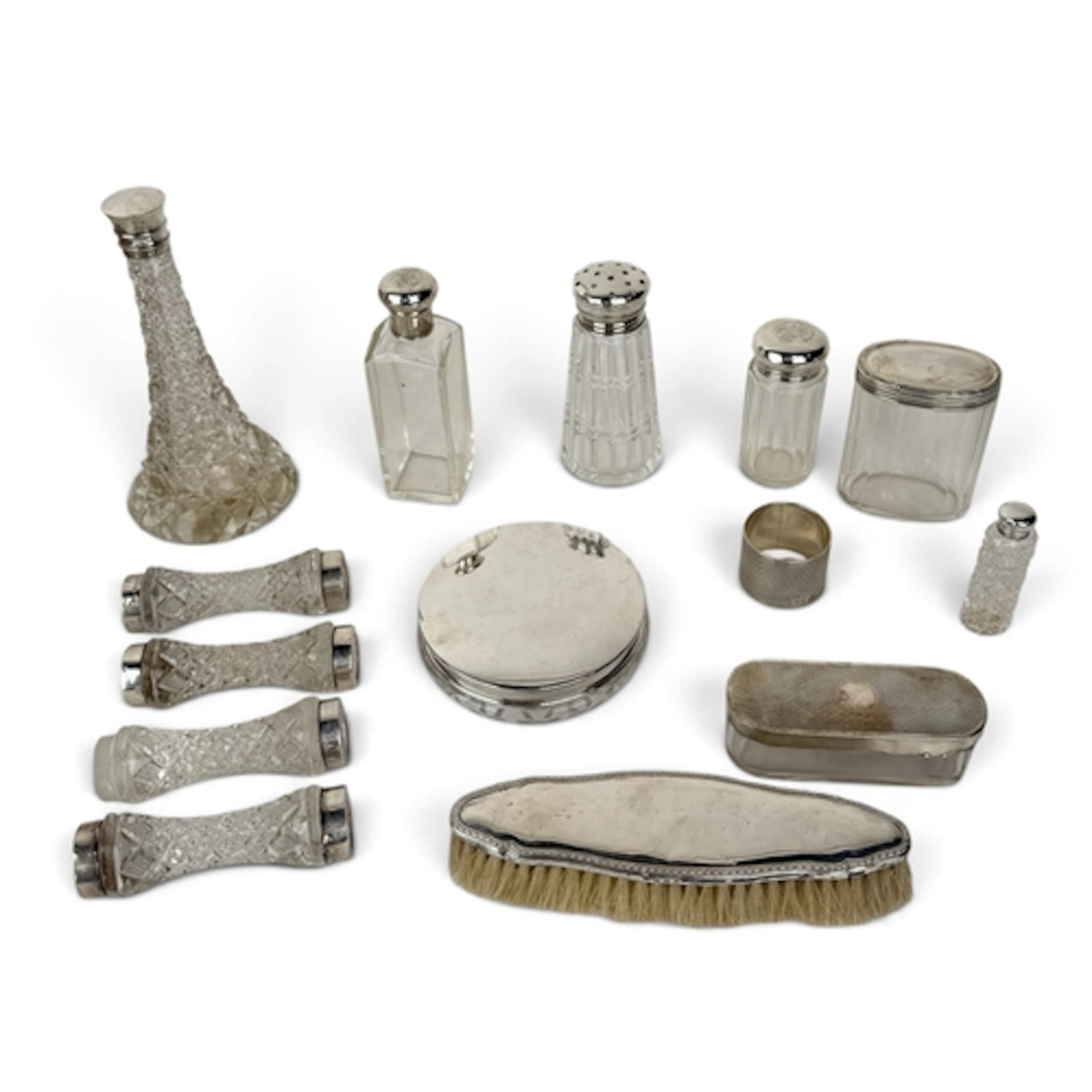A COLLECTION OF SILVER SCENT BOTTLES, SILVER TOPPED BOTTLES,...