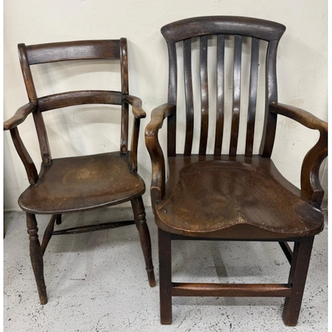 Two vintage oak open arm chairs
