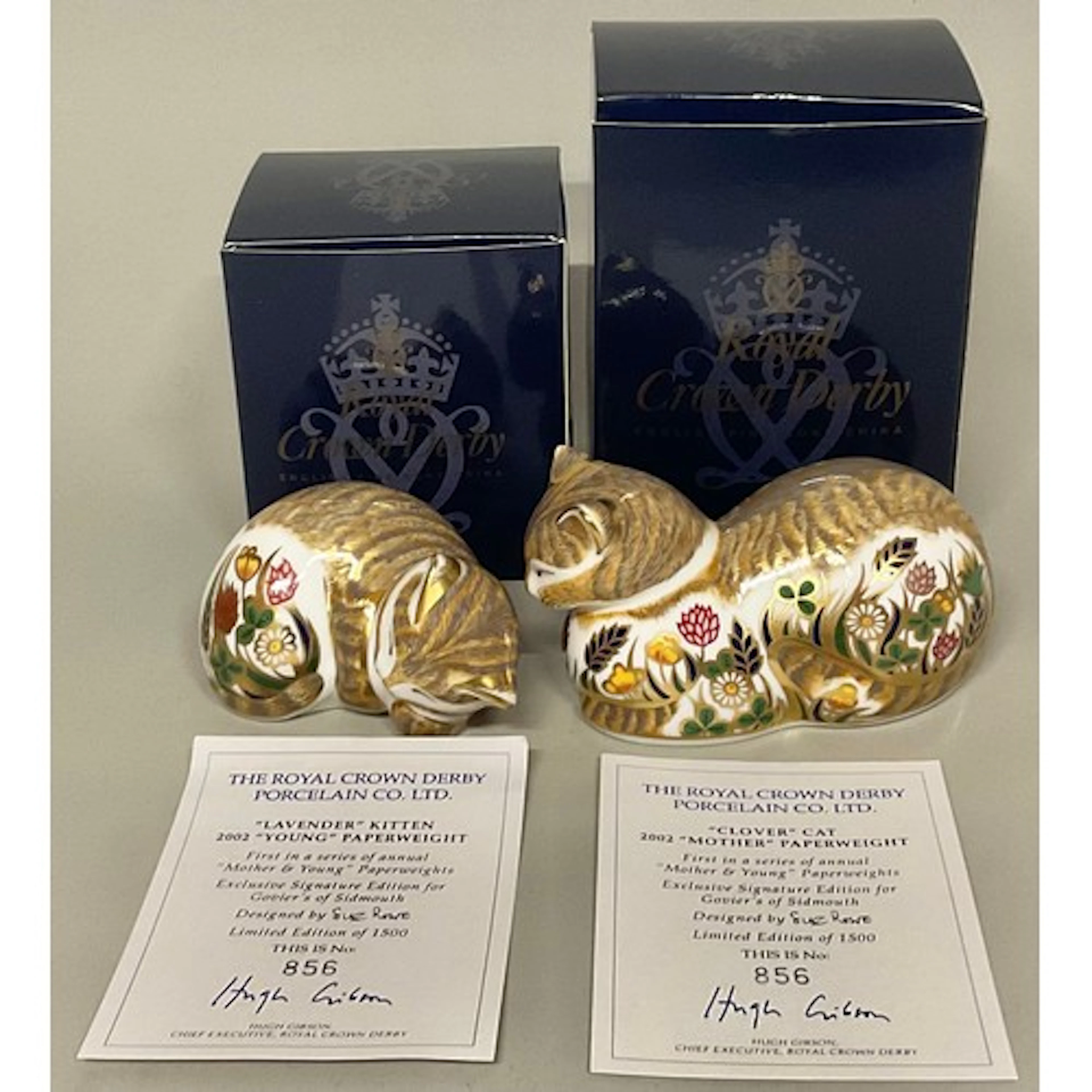 A pair of Royal Crown Derby paperweights, comprising "Clover...