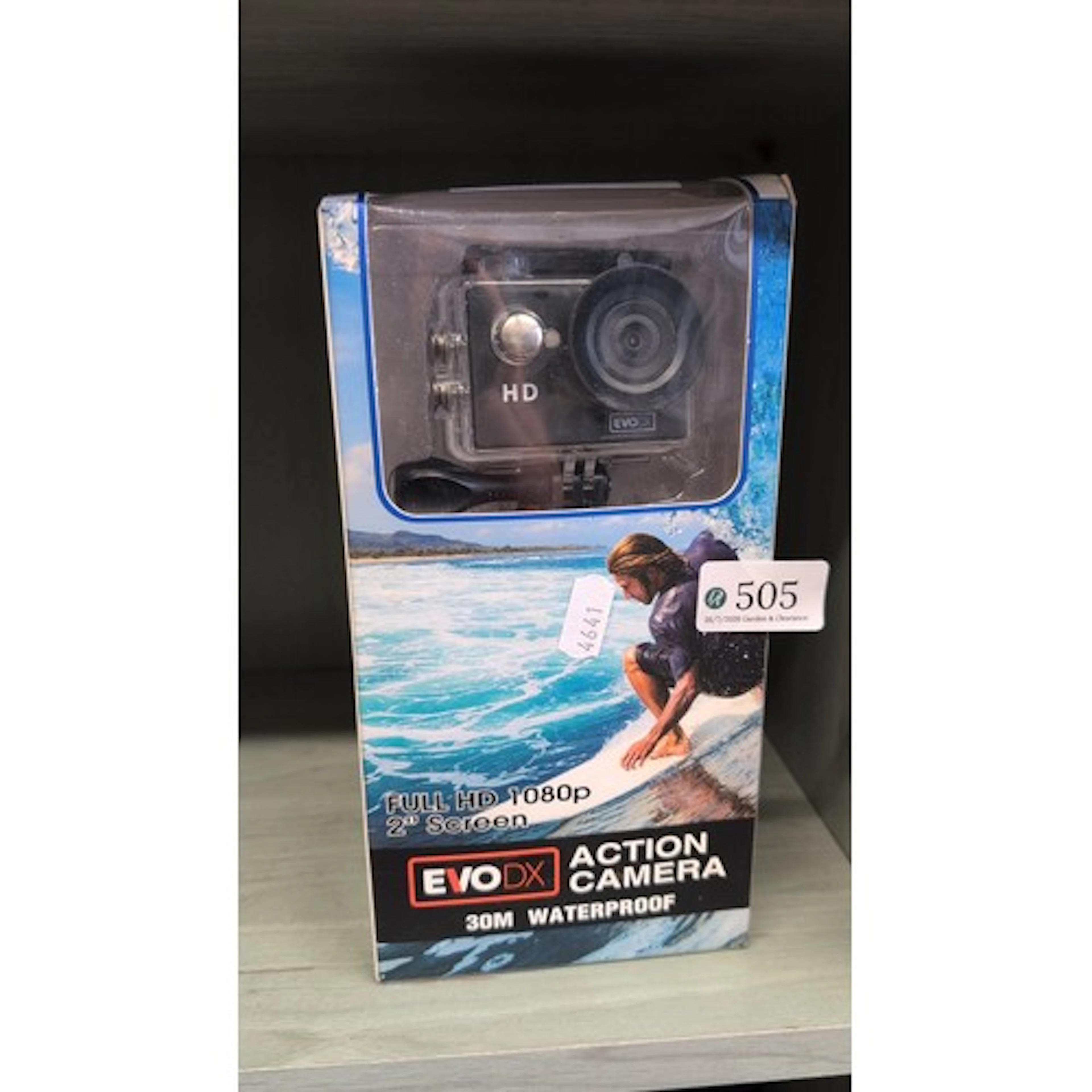 EvoDX action camera with clear waterproof housing, labelled ...