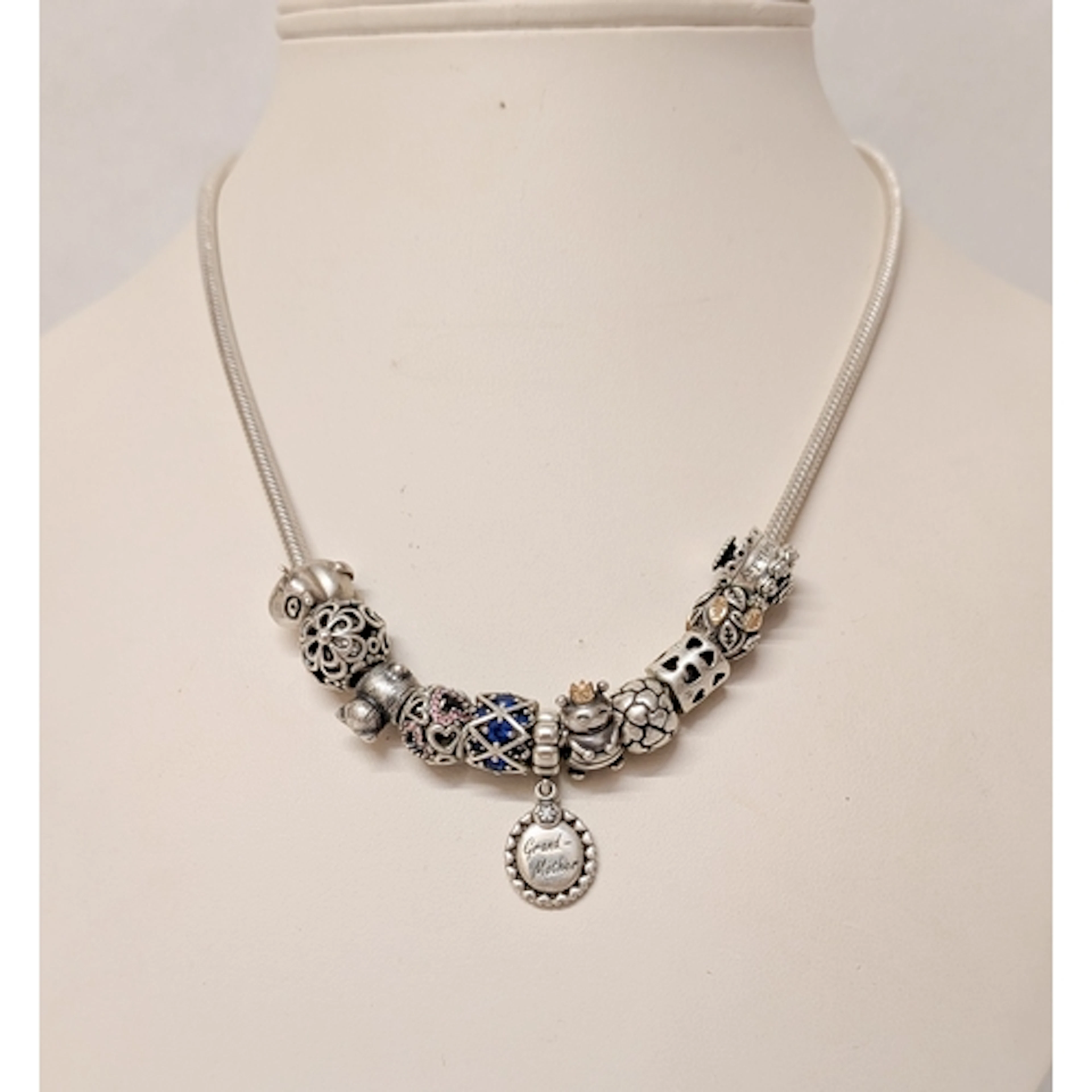 Pandora - a silver necklace set with eleven silver charms an...