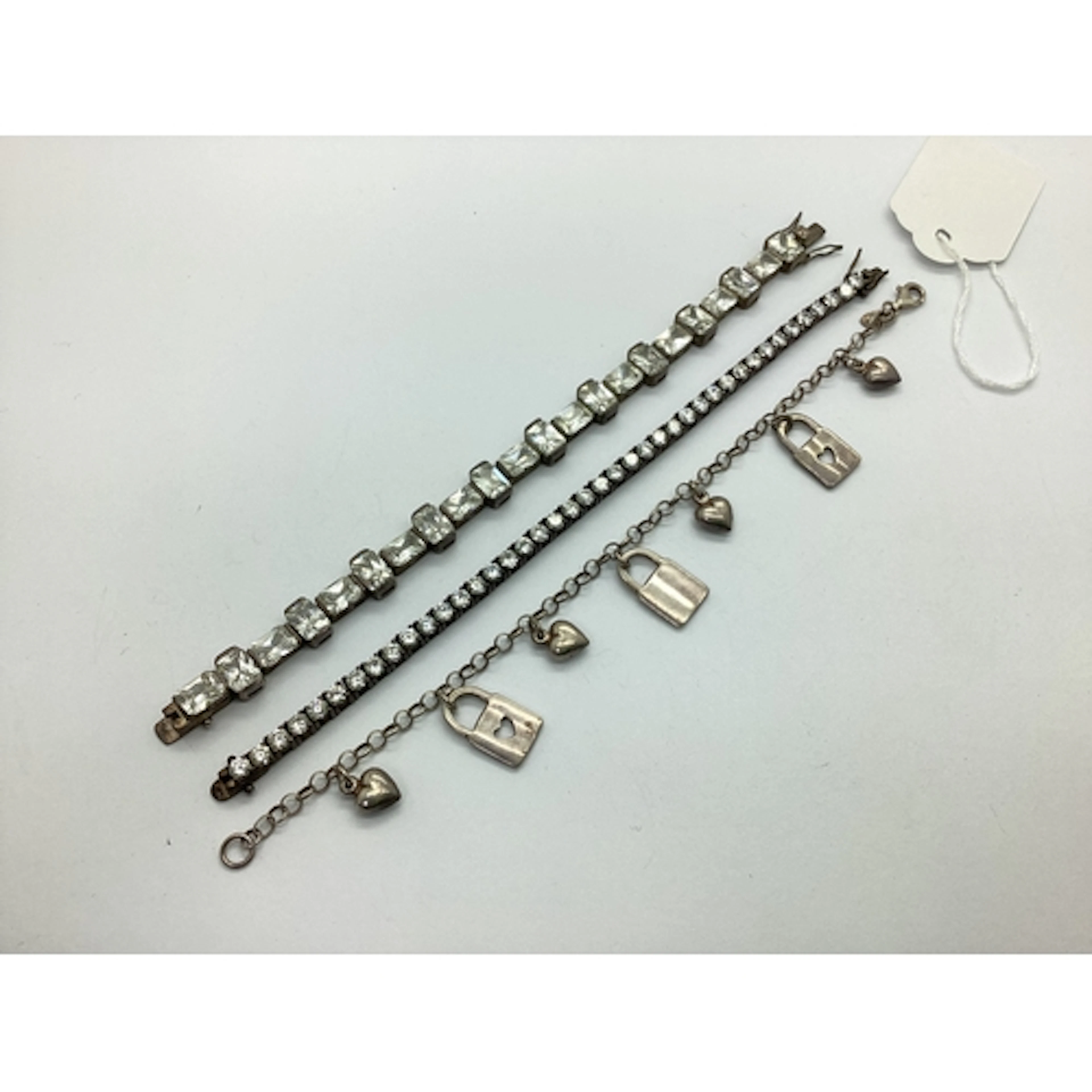 A Modern Claw Set Line Bracelet, of uniform design, to snap ...