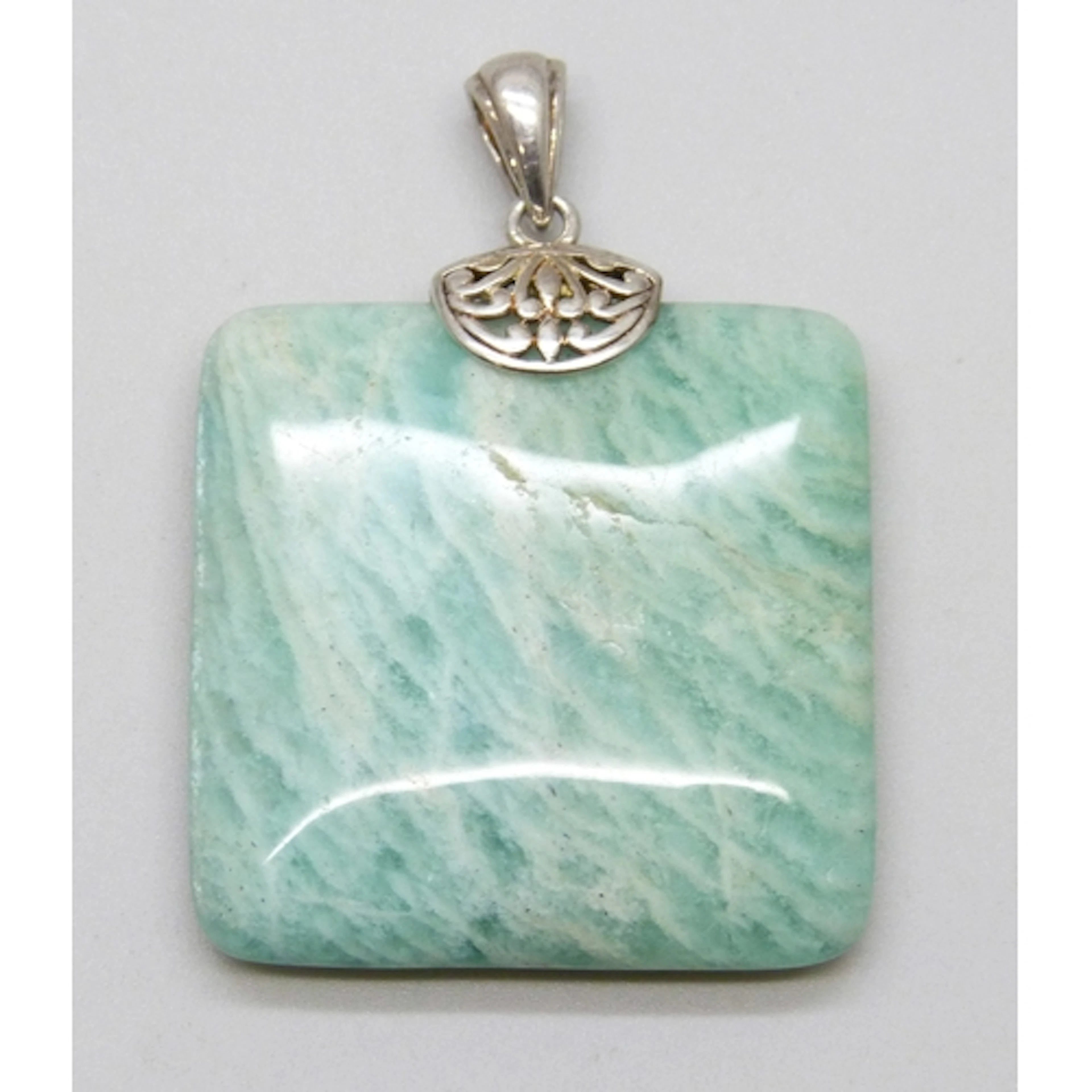 A silver and amazonite necklace pendant, 5.2cm including bai...